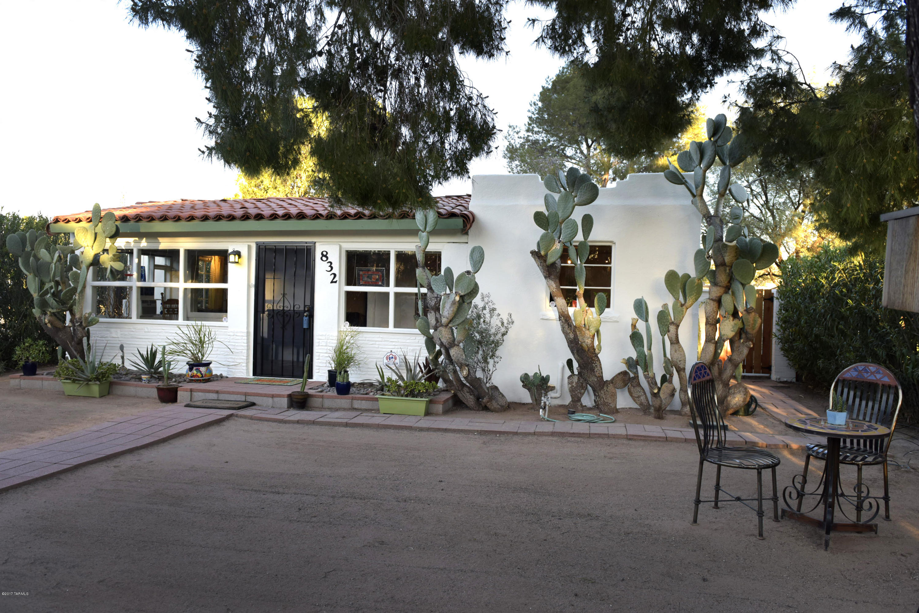 Charming Mission/Spanish Revival midtown home adjacent to 3rd Street bike path. Light filled, yet cozy Arizona room greets you as you enter.  Exposed beams, arched doorways, concrete and Saltillo tile floors and newly painted interior throughout create an old world feeling. Updated kitchen and baths.  NEW ROOF in 10/2016 with skylights.  Large private yard with mature Aleppo pines and oleander privacy hedge. Enjoy sitting under the covered patio overlooking thoughtfully landscaped, low care plants, completely surrounded by the walled yard with new redwood gates. Attached extra workroom/shop space (bike palace).  Plenty of off street parking.  Did we mention the exterior was just painted?  Don't miss seeing this beautiful, well cared for home.