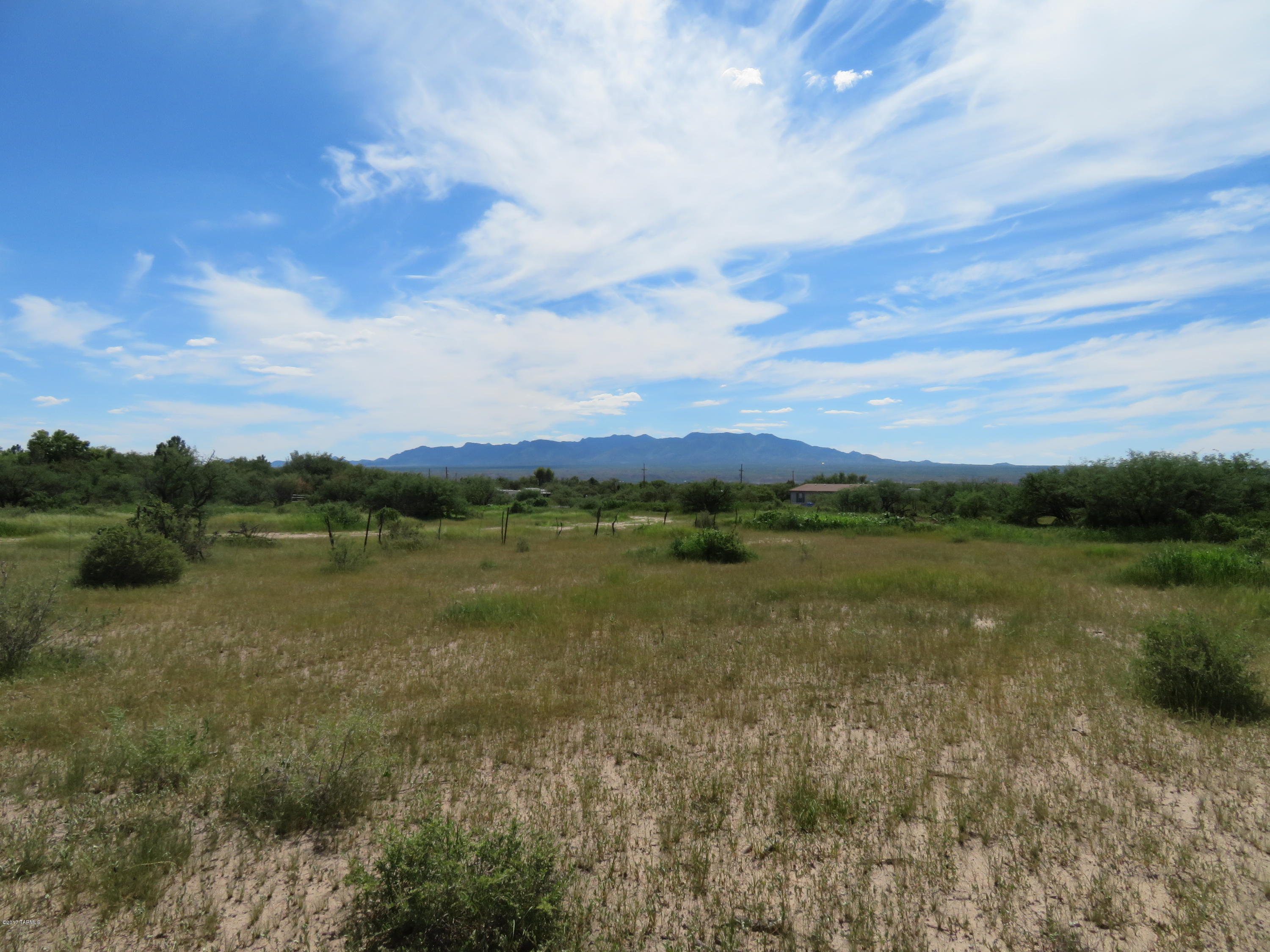 Picturesque St David 3.32 Acre Parcel of Land ready to build or place MFG Home. St.David Domestic water, electric, telephone at Southeast lot line. Great Central St.David Location. Not in a flood zone. Nice Mountain ranges surround this property. Big mesquite trees.Located just a short distance from a paved country maintained road.