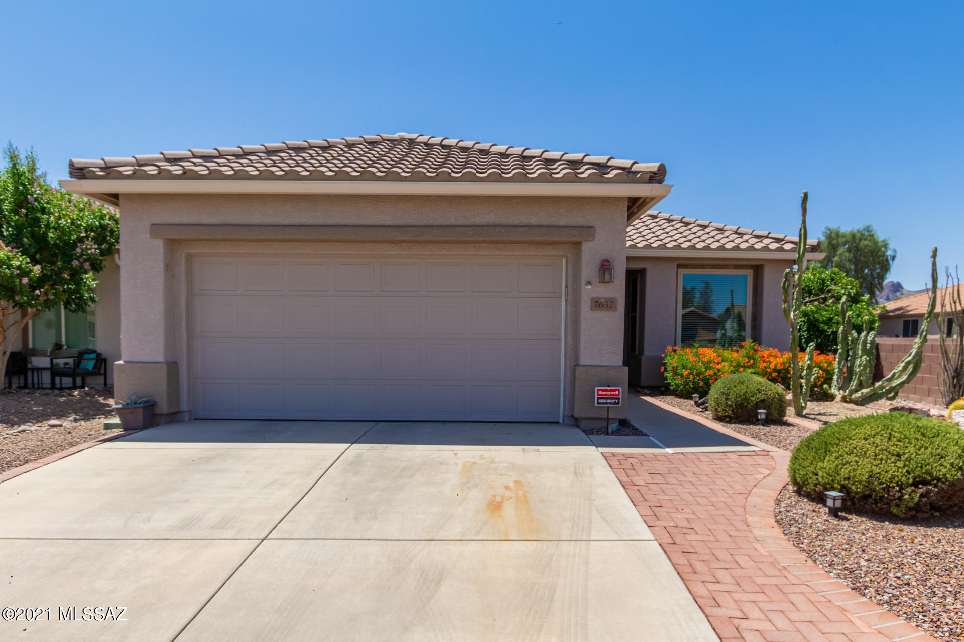 Turn-key home with excellent curb appeal, desert landscape, and a 2 car garage is now on the market! Interior boasts earthy tones, tile floors in main areas, mudroom w/built-in shelves, ceiling fans, and a spacious living/dining room combo. The chef's kitchen includes SS appliances, ample oak cabinets, granite counter tops, and a lovely breakfast room with wainscoting. Spacious master retreat has a bay window, walk-in closet, and its own bathroom. Sit back & relax in the cozy screened in patio & enjoy your favorite beverage. Covered patio with paves, decorative gravel, and fragrant laurels are some of the features you will find in the backyard. What are you waiting for? Pack your bags and move-in! NEW ROOF New Windows.