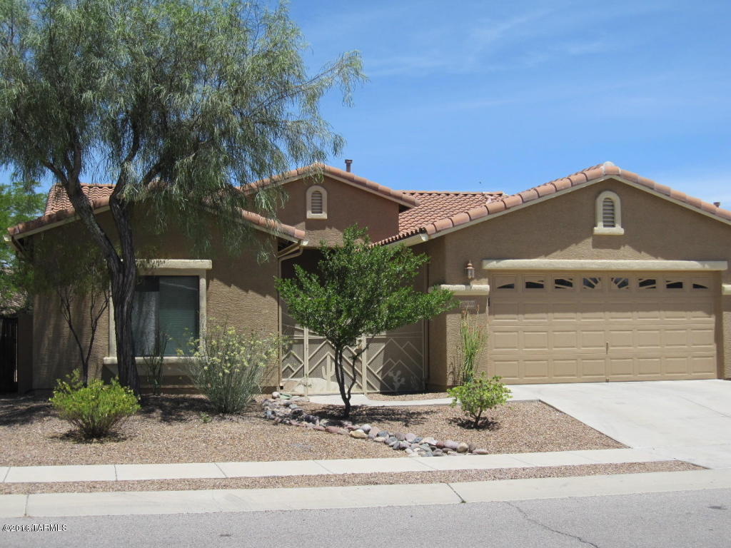 Don't miss this exceptional home in Mesquite Ranch, located in the highly rated Vail School District! Well-maintained, quality built, popular floorplan by Monterey Homes. Updated Kitchen.  All the roominess of a two-story house, but all on one floor! Bonus room to use as a den, indoor workshop, exercise room, or other unique use to enhance your life. Extra lg Master Suite with walk-in closet. Master Bath with double sinks, large shower and garden tub. Bay windows at Kitchen and Master Bedroom. Wood laminate flooring in the Great Room and Master Bedroom, cushioned with cork (easier on the joints). Beautiful Southwest scene hand crafted in stained glass in custom privacy wall enhances the backyard sanctuary. Spacious 2-car garage with 4 ft extension. (See additional remarks) New granite countertops, microwave, stainless sink and faucet.  Pull out cabinet shelves in master bath and kitchen. Professionally landscaped, low maintenance yard gives you more time to enjoy the hot tub and mountain views and unwind from your busy day. Artificial grass. Over-sized Covered Patio with misting system. Sola Tubes save on electric bills and illuminate both baths. Ceiling fans throughout, including the Patio. Enjoy 2 community pools without the maintenance. Access to patio from 2 sliding doors. Security screens on all exterior doors make it easier to "lock and leave".  Small storage shed included. Exterior was repainted in 2013. Irrigation system was rebuilt in 2015. Multi-use path, small parks, playgrounds, basketball and volleyball within the community. Close to Davis Monthan and I-10. Convenient commute to Raytheon.