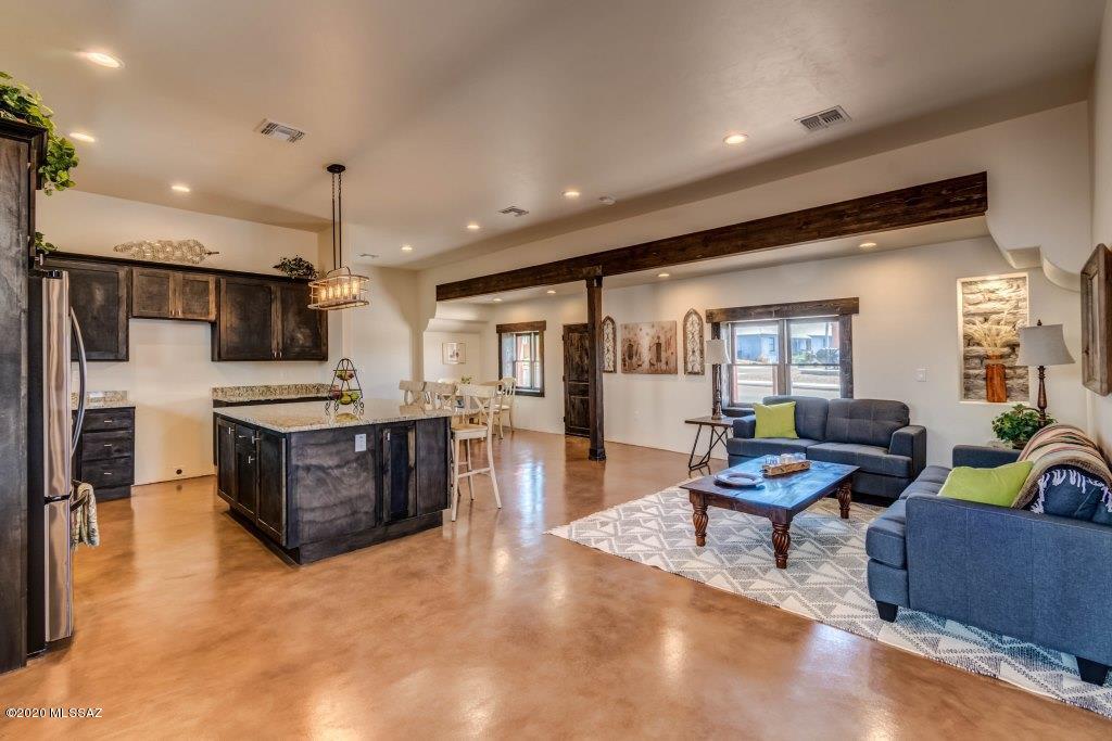 Come see this Beautiful New Custom Built Home located in the Historic Barrio Viejo Neighborhood!! Located just south of downtown and close to the Mercado!! This gorgeous house will stun you with its modern and dazzling interior finishes. This stunning home offers spacious interior, generous rooms, Amazing design flow, astonishing polished concrete floors & High ceilings throughout! The Open Kitchen Boasts of Beautiful Custom Cabinetry,Granite Counter tops, Back-splash,Massive Kitchen Island,Walk-in Pantry and Black Stainless Steel appliances. Great Room Concept w/ Living Room, Dining area and Den/Office area off Kitchen. Hall Bath w/ Granite Countertops, Custom dual sinks and custom tile surround bath. Spacious Owner's suite w/ large walk-in closet.  Owner's Bath w/ custom vanity and