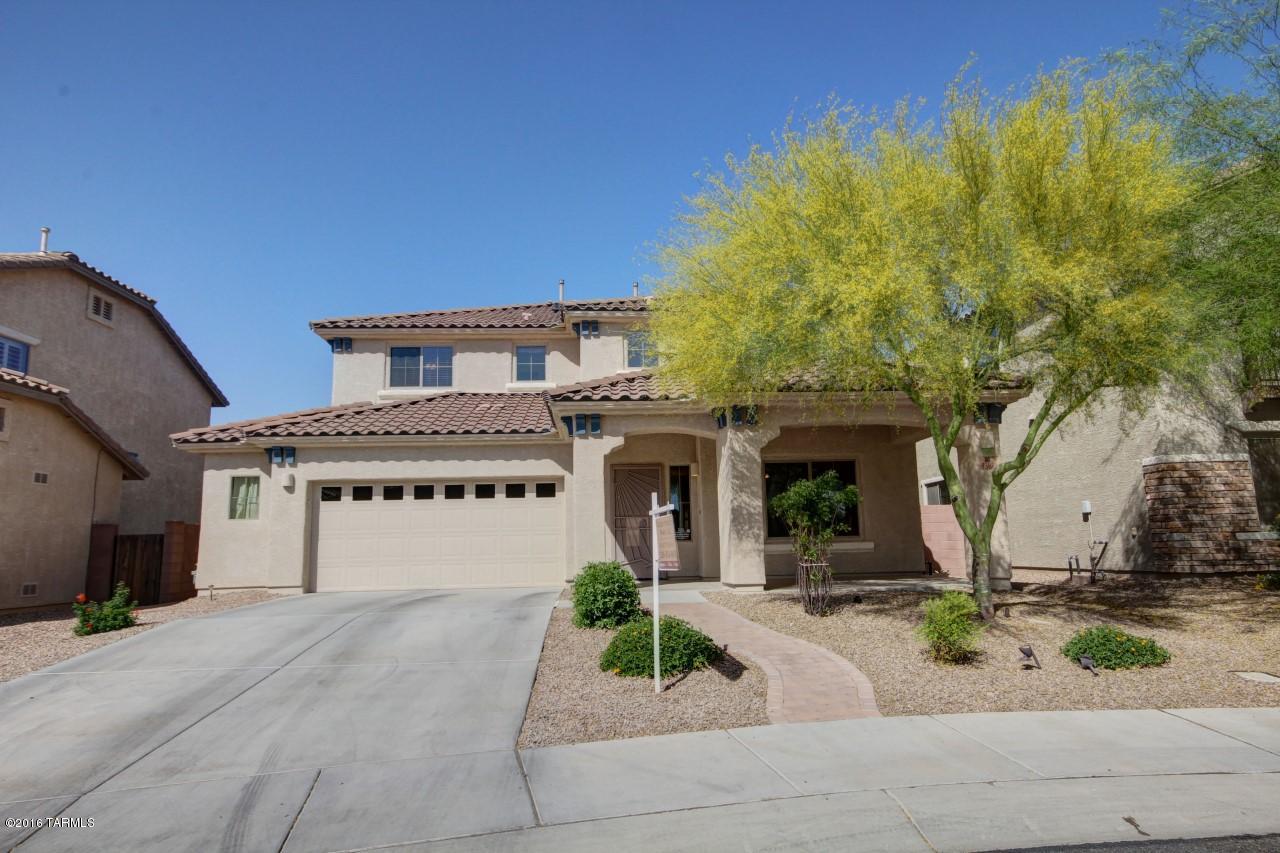 Gorgeously upgraded 5bd/3bth home with resort style backyard in gated Tangerine Crossings!  Solar heated, salt water pool with turf and built in trampoline will provide hours of family entertainment. Open and bright floor plan with separate formal living, dining, and family rooms. Beautiful kitchen with corian counters W/integrated sink, knotty alder cabinets w/pull outs, custom tiled backsplash, and upgraded appliances. UPGRADES GALORE: Large Covered patio, nice deck off master bedroom with amazing 180 degree views, big loft, home theater package, central vacuum system, wood blinds, porcelain tile in all wet areas/main family room, termite blocker impasse system, lots of nice hardscape. One Owner Home, Meticulously maintained! Shows beautifully! Owner is licensed real estate broker.