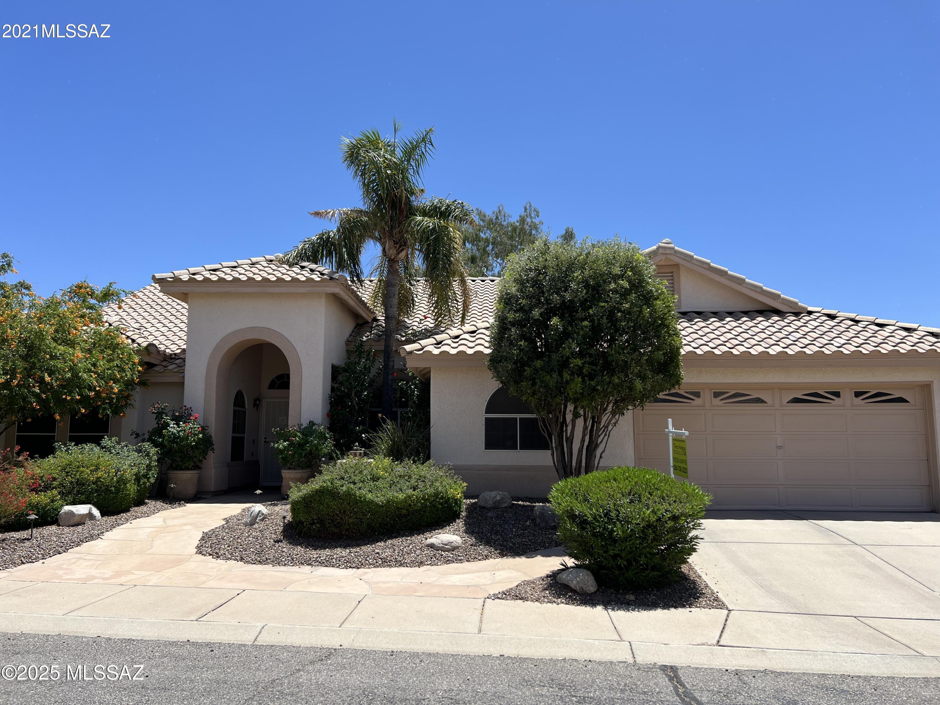 Located in sought-after Canada Heights, this spacious 5-bedroom, 3-bath home sits on a nearly ¼-acre lot at the end of a quiet cul-de-sac. Enjoy breathtaking views of Pusch Ridge from your resort-style backyard featuring a newer lagoon pebbletec pool with lush landscaping, mature citrus trees and gazebo. Your own private oasis.

Inside, soaring ceilings and a flexible floor plan offer room for everyone. The 5th bedroom can serve as a guest suite or home office.Major upgrades include a primary bathroom remodel (2021), guest bath remodel, new flooring, new roof (2016), and newer AC units (2017 & 2025). Don't miss this hard to find 5 bedroom gem**All new professional paint including doors just completed. Neighborhood streets being repaved July/Aug 2025