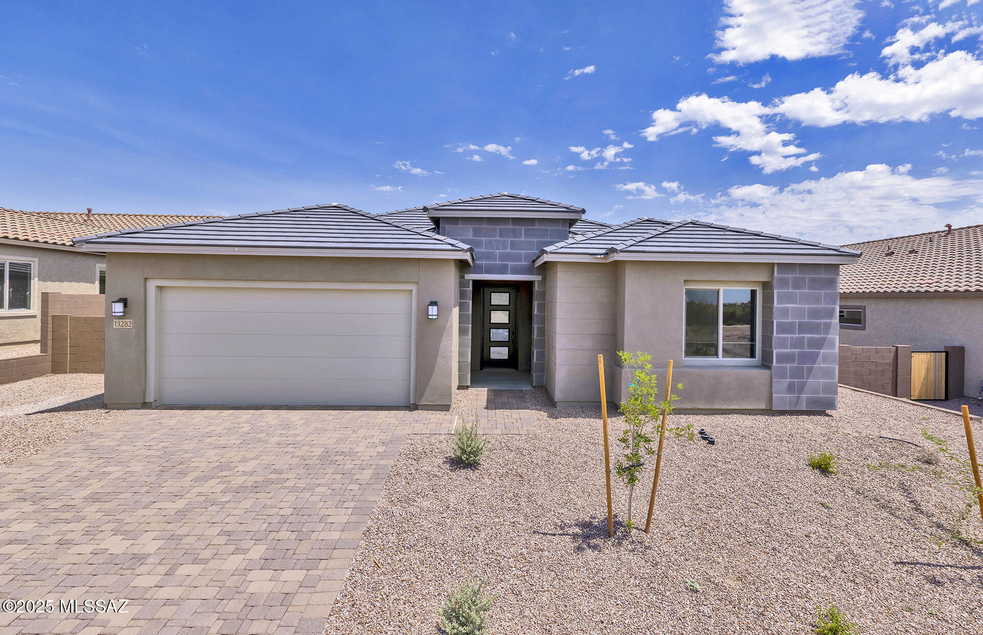 This stylish split floor plan features a contemporary exterior with a paver driveway and walkway. Inside, enjoy a Chef's Kitchen with a gas cooktop, stainless steel Whirlpool appliances, upgraded Coastal Shaker Maple Dusk cabinets, Bianco Aspen quartz countertops, and a custom backsplash.

Quartz counters continue in both bathrooms, paired with 15''x30'' Enlite Awaken tile flooring in a sleek straight-stack layout.

Energy-efficient features include a tankless water heater, dual-pane windows, low-flow showerheads, and water-saving toilets.

Ready for move-in July 2025—don't miss it.