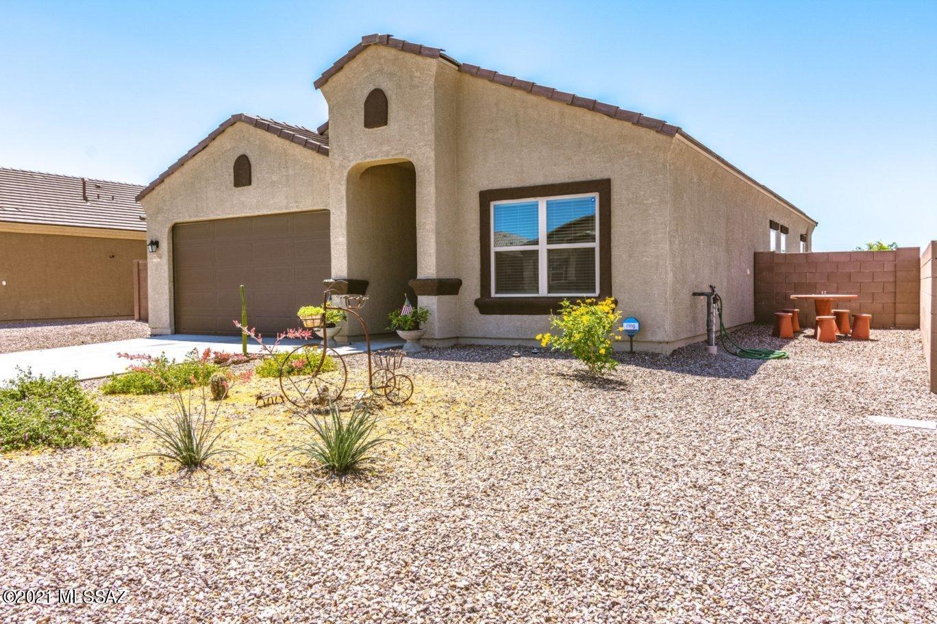 2019 DR Horton 1712sf Smart home on a large desirable corner lot, Open floor plan with high ceilings and fans. Kitchen has gorgeous granite island, walk in pantry, stainless steel appliances, upgraded refrigerator door and looks out over a spacious great room.	Tile everywhere except bedrooms. Big Master bedroom with walk in closet.	Master bathroom has double sinks, shower and closet. Garage has side door to the yard, upgrade bigger garage doors, sink plumbed, soft water softener loop, and 220 with 50amps available.	Large double gate on the side yard leads to a comfortable back yard with a covered patio and upgraded fan to keep you cool in the summer. Backyard overlooks onto the walking path/park with a orange and grape fruit trees.  See More... Solar panels are being purchased so buyer does have to assume current loan.
