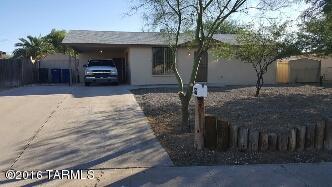 Remodeled and updated Masonry home within walking distance of park, public pool and elementary school. Huge great room stretches front to back to create spacious and bright ambience! Large Master bedroom. NEW kitchen/bath cabinets and counter tops. NEW interior paint, NEW carpet in bedrooms, NEW custom stained concrete flooring. NEW fixtures. NEW water heater. NEW dual Pane windows. HUGE backyard with double gate entry and large covered patio. Mature landscaping front/back yards. This home has been professionally cleaned and is move-in ready! Sellers are licensed real estate agents in Arizona. Home is close to shopping and amenities such as park, elementary school, public pool.