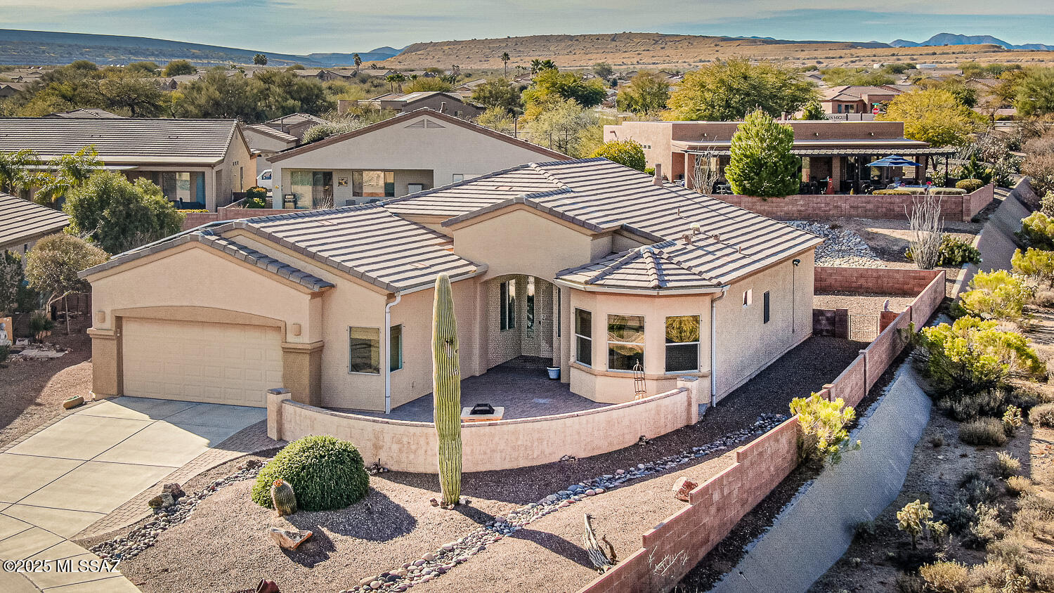 Beautiful Las Campanas Home, you enter in to a front courtyard and sets next to HOA common area. A great room floor plan, 2 bedrooms, 2 baths, den, Arizona room, hobby room and a large 2 car garage. Features many great features includes: tile/wood flooring, beehive fireplace, oak cabinets, gas range,  solar tubes, laundry tub, built-in cabinets in garage and many more great features, This home has an Owned Solar System, approx. $20 per month electric bills. Must see!