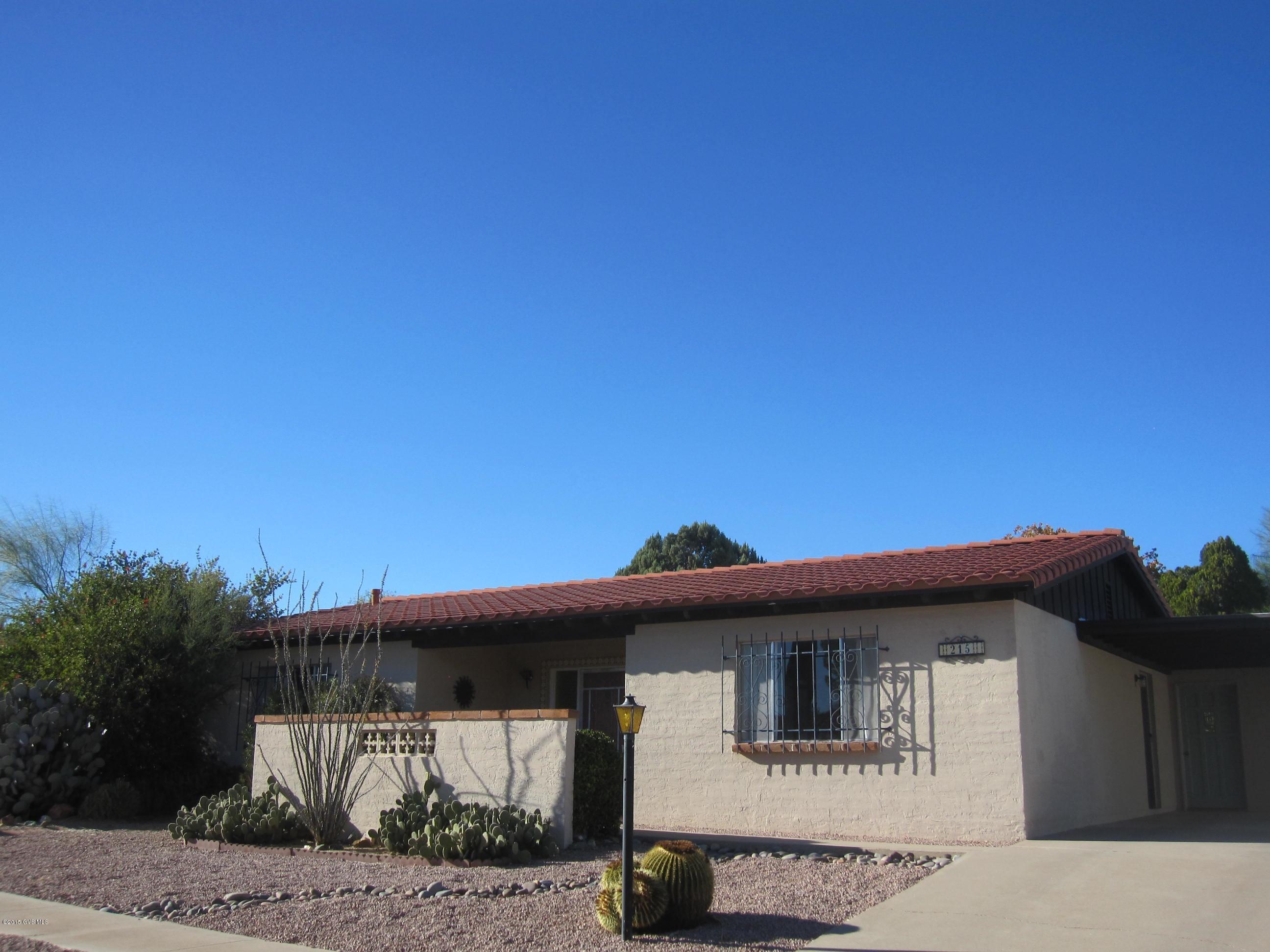 OPEN, BRIGHT, CHARMER! LOVELY MOUNTAIN VIEWS FROM THE FRONT, AND A KNOCKOUT OF A BACKYARD COMPLETE WITH ORANGE AND TANGERINE TREES LADEN WITH FRUIT! SIT ON THE PATIO AND DRINK IN THE TROPICAL GREENERY IN THIS PRIVATE, SPACIOUS YARD! SOLID MASONRY CONSTRUCTION WITH CONCRETE TILE ROOF! HOME IS BEAUTIFULLY TILED THROUGHOUT WITH 17-1/2 INCH CERAMIC! ENTER THROUGH LARGE OPEN FOYER INTO GRACIOUS GREATROOM. KITCHEN IS OPEN TO DINING AREA AND HAS SPACE TO EAT AT THE TILED COUNTER. THE LAUNDRY IS PART OF A LARGE STORAGE ROOM/WORK AREA WITH WINDOW. MASTER BEDROOM HAS WALK-IN CLOSET. INTERIOR FURNISHINGS INCLUDED! WIDE, COUNTY-MAINTAINED STREETS GRACE THE NEIGHBORHOOD. HOMEOWNERS ASSOC DUES ONLY $42 ANNUALLY! GVR FACILITIES WITH POOL, SPA, AND PICKLEBALL NEARBY AT THE EAST CENTER. HURRY!