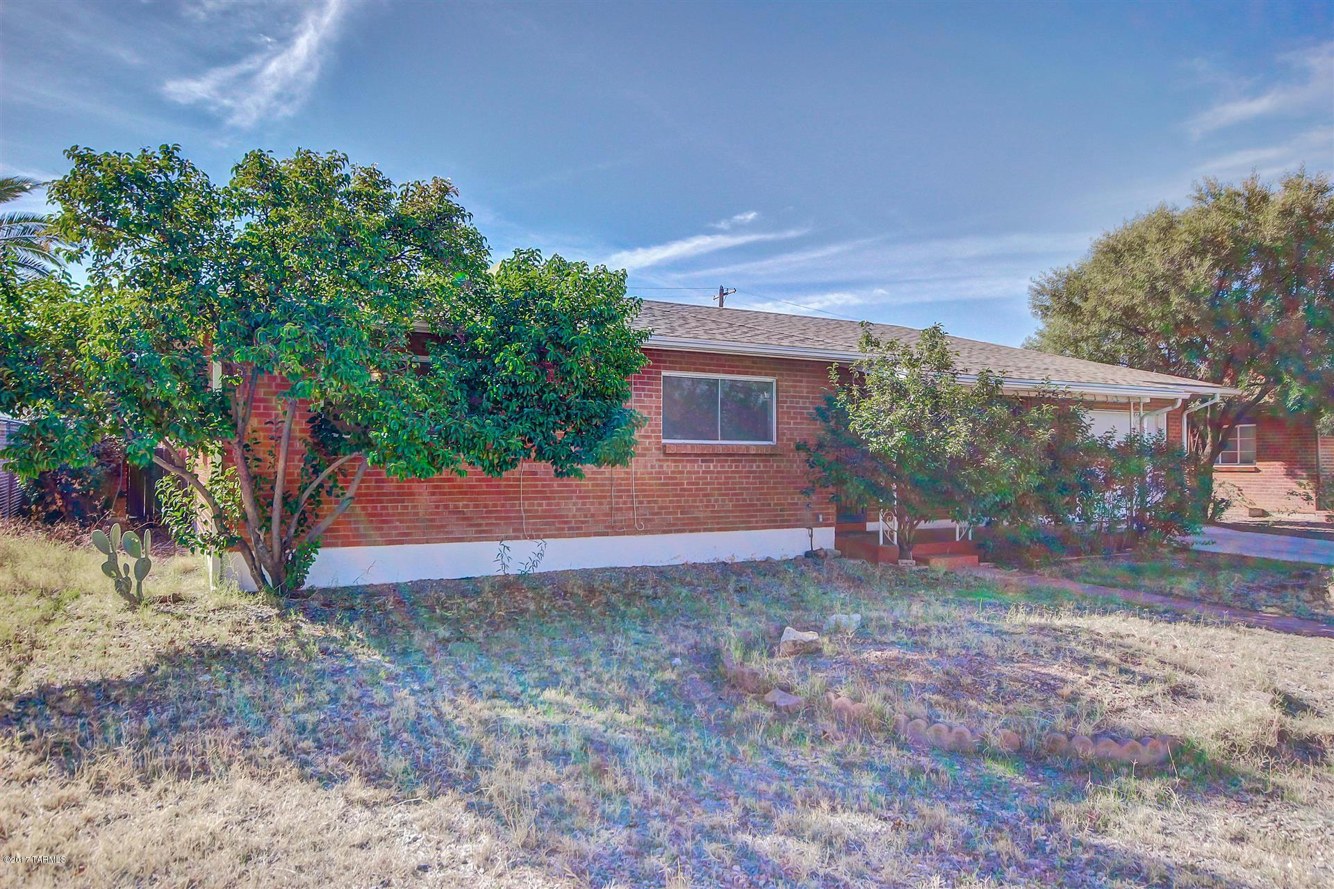 Great Central location! Close to U of A, hospital, shopping, parks and Mountain Avenue bike path. Solid brick home with a large backyard. Move in ready with 3 beds and 1.75 baths. There's plush carpeting, a flexible interior palette and flowing floorplan. The functional kitchen is equipped with ceramic tile counters, plenty of cabinets and pass through to the living room. Sizable spare bedrooms, plus a full bath. The master has attached 3/4 bath and built-in closet. Spacious backyard contains covered patio, storage shed and RV gate with room for parking. Come see today!