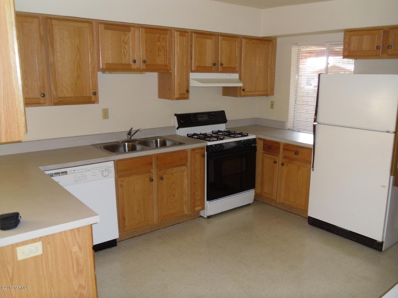 WORK COMPLETED, AVAIL FOR VIEWING!  Spacious 2 bedroom w/den or 3RD BEDROOM, 2 bath end-unit in central triplex. Unit has AC, covered privacy patio and 3 ft privacy fence. Interior features include dining area off kitchen, living room, two large bedrooms (one has built in shelving), den can be used as small 3rd bedroom, washer/dryer. Pet up to 18 lb only with pet fee. Water/sewer/trash included in rent.