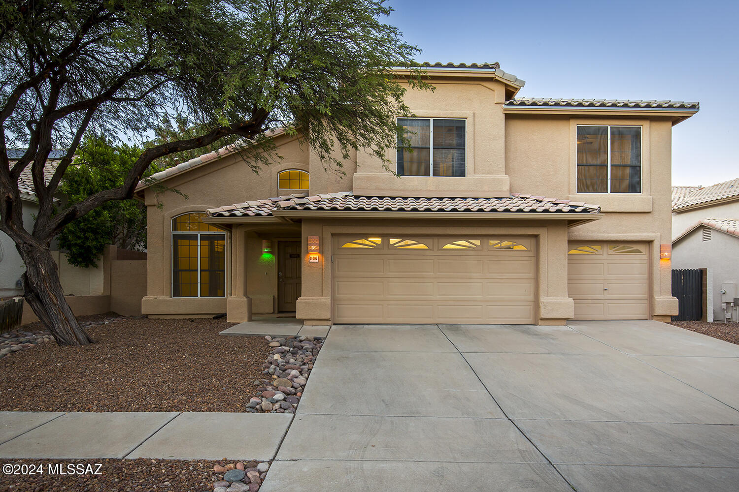 Move-in ready home in Oro Valley's community of Copper Creek. This 4 BD/2 ½ BA/2,448 Sq.Ft/3 car garage home offers separate living area, family room w/entertainment center, dining area & laundry room. Spacious kitchen offers plenty of cabinet & counter space, island, breakfast nook, stainless steel appliances, pantry & desk area. Primary suite has a large walk-in closet, dual vanities & separate tub & shower.  Large backyard offers a covered patio & sparkling pool & spa, perfect for entertaining.  NEW roof installed 2020.