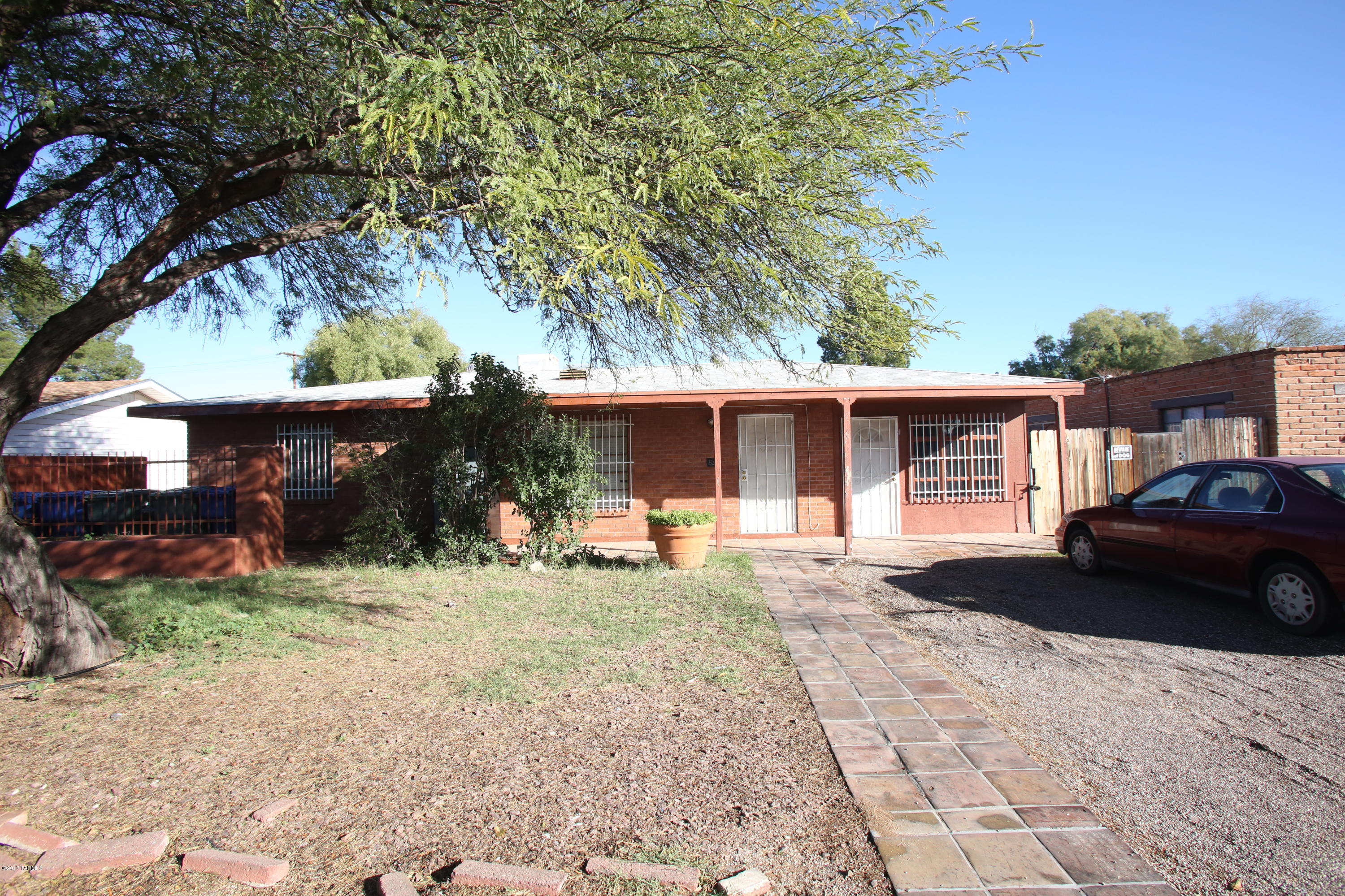 Great duplex in a convenient central location close to the U of A, Tucson Mall, St. Philips plaza and so much more. One 3 bedroom unit has an office with separate entrance that could be used as an extra bedroom. Back unit is a 3 bedroom, with detached 4th bedroom with its own bathroom! Both units could rent for $1200 or more.  C of O for Residential Care services on file with the city of Tucson issued in June of 2010.