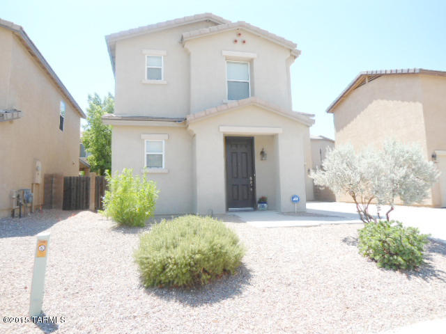 This 3BR/2.5 BA 1855sq. ft. home w/upstairs loft blends style and charm in the highly desirable Riverhaven neighborhood in Central Tucson. Enjoy the many unique features that include a newly painted downstairs, the sought-after split bedroom plan, a master suite with walk-in closet & lg linen closet, custom wood blinds, an upstairs laundry room with newer washer/dryer still under warranty, a giant walk-in pantry, a recently refurbished refrigerator, newly installed AC compressor and upgraded hardware. Invite friends & family to share food & fun in the lg open kitchen w/beautiful tile floors and a covered back patio perfect for entertaining or just relaxing outdoors. The extra long driveway provides plenty of parking for guests.