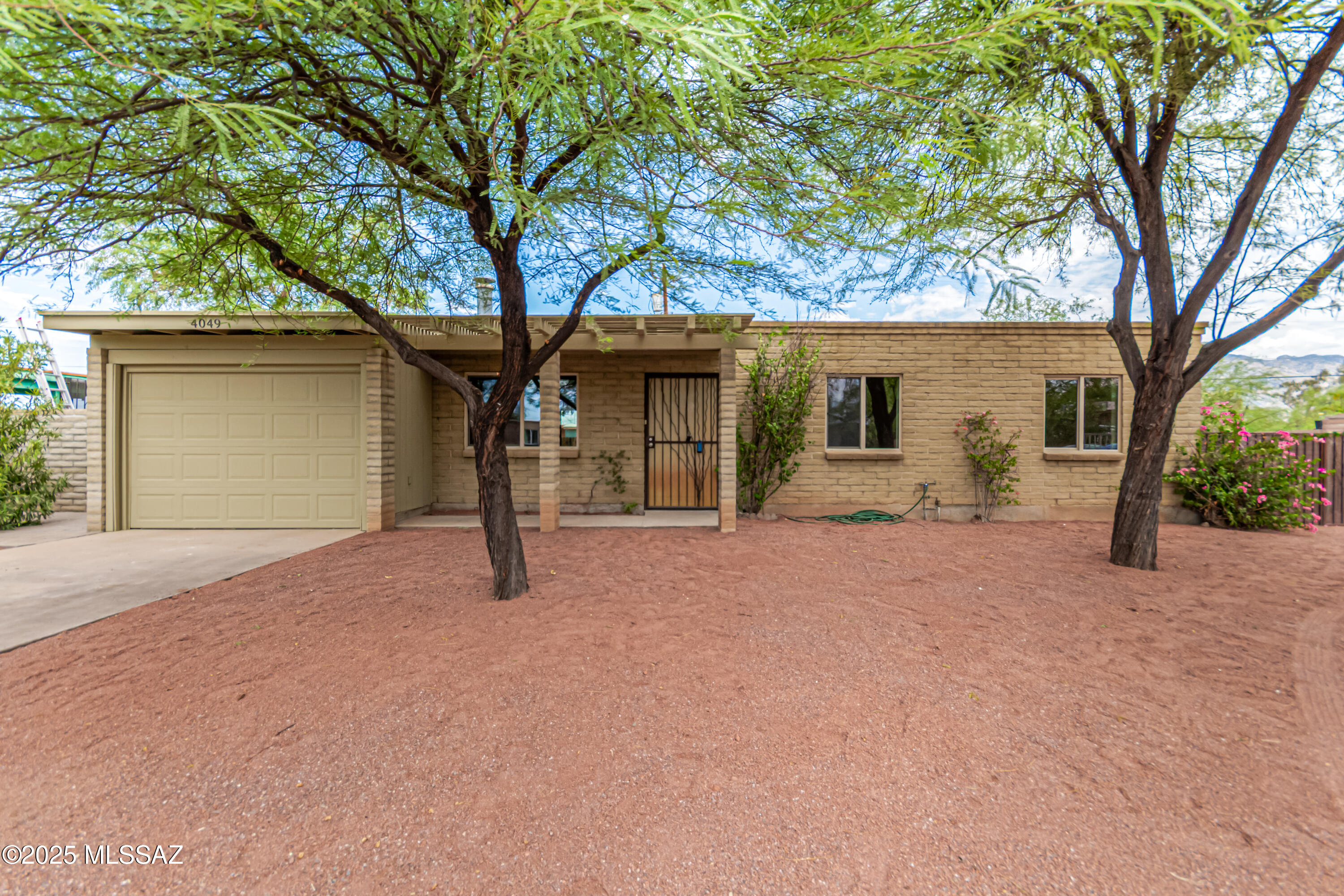 **Recently Renovated 3BR/2BA Single-Family Home**

Beautifully updated single-family home featuring 3 bedrooms, 2 bathrooms, and stunning Saltillo tile flooring throughout. This move-in ready gem includes a convenient laundry room and 1-car garage for added functionality. 

Fresh renovations blend seamlessly with authentic southwestern character, creating warm and inviting living spaces. The rich terracotta tones of the Saltillo tile add timeless charm while being both durable and easy to maintain.

Perfect for buyers seeking classic Arizona style with modern comfort and convenience. Don't miss this opportunity!