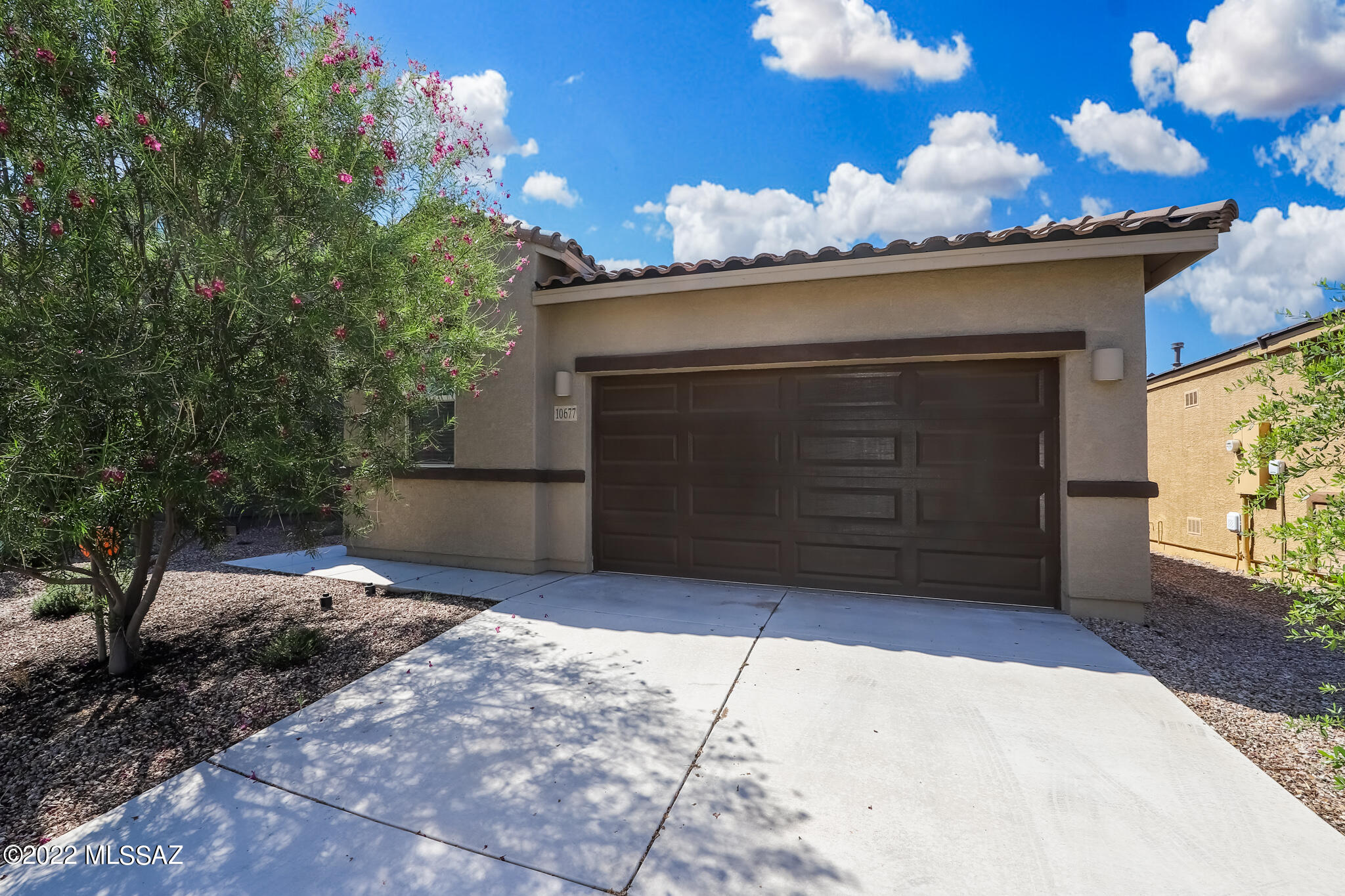 Gorgeous and move-in ready, single story Meritage home that was built in 2020.  Stunning granite countertops with an island, subway tile backsplash, pantry closet and dark cabinetry are stand outs in this kitchen! Open concept living spaces, no carpet and ''wood-look'' tile throughout make this family-sized home easy to keep up with. Beautifully landscaped backyard with an additional shady spot awning to enjoy the plants and fruit trees.  Neighborhood parks, walking trails and easy access to I-10 making this an ideal home in Gladden Farms. Make a showing appointment to view this delightful home!
