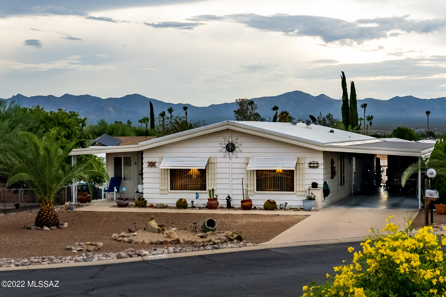 Enjoy those Mountain Views! This 2 bedroom, 2 bath Home with many upgrades  situated on a large lot located in desirable Pueblo Estates. Vaulted ceilings in Living Room & Dining Area. Eat in Kitchen with lots of storage. Appliances replaced 2018.  Dual Pane Windows.  This home has Laminate and  ceramic tile flooring. Heating & cooling, new, April 2021. The well sized Arizona room opens to a screened porch which has access to a fenced in back patio & large yard for viewing those great mountain views, sunrises & sunsets. $60.00 a month HOA fee includes, trash, road & common area maintenance, rec center, heated pool, hot tub, billiards, ceramics, library, card games, bingo, shuffleboard, etc.... Close to shopping, restaurants, place of worship, doctors, hospital & golf.  NO GVR but avail.
