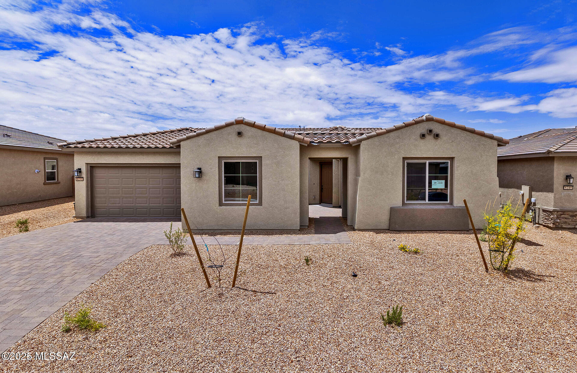This elegant Voyage floor plan offers 3 bedrooms plus a den, 3.5 baths, and a 2-car garage with an additional cart garage. With 10' ceilings, a walk-in pantry, and a tankless water heater, the home is designed for both comfort and style. Enjoy gas connections in the kitchen, laundry, and backyard, along with a beautifully framed walk-in shower in the owner's suite. The kitchen boasts upgraded Coconut cabinetry, a gourmet culinary layout with stainless steel appliances, and pre-wiring for ceiling fans and pendant lighting. Thoughtfully selected design finishes complete this impressive home. Clubhouse is open.