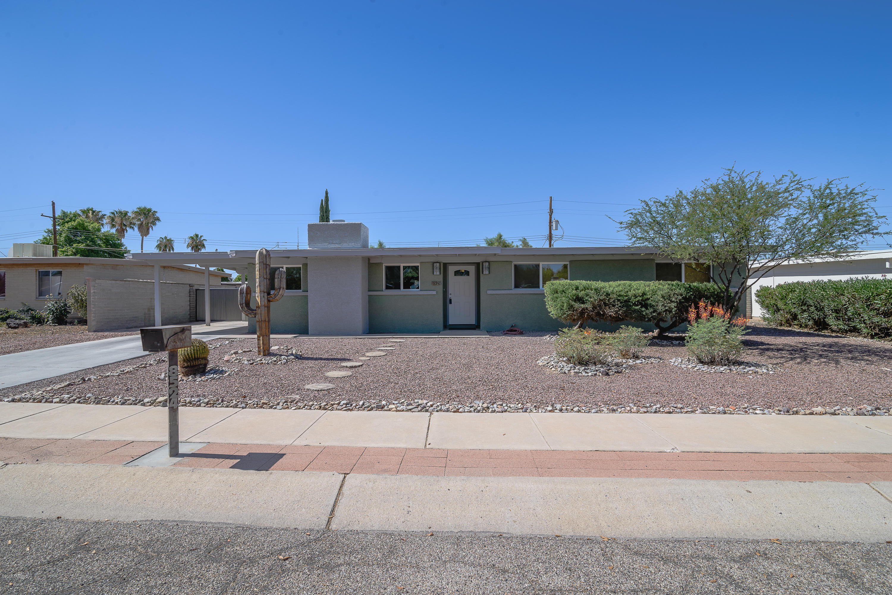 List Range Pricing; Seller will accept or counter offers between $199,900 - $205,000. Beautifully remodeled home on the Eastside... Open kitchen with granite countertops and french doors to the backyard. Large laundry room off kitchen/dining area offers plenty of extra storage. All appliances convey. New Roof. Home is stucco over block & well insulated. Second set of French doors in the master bedroom. Solar tube in living room & skylight in kitchen offers bright natural light. Grand fireplace in living room. Tile & Laminate wood flooring throughout. Backyard features high custom iron gate/fence, covered patio, beautiful iron Saguaro in front yard. Great location close to shopping and so much more!