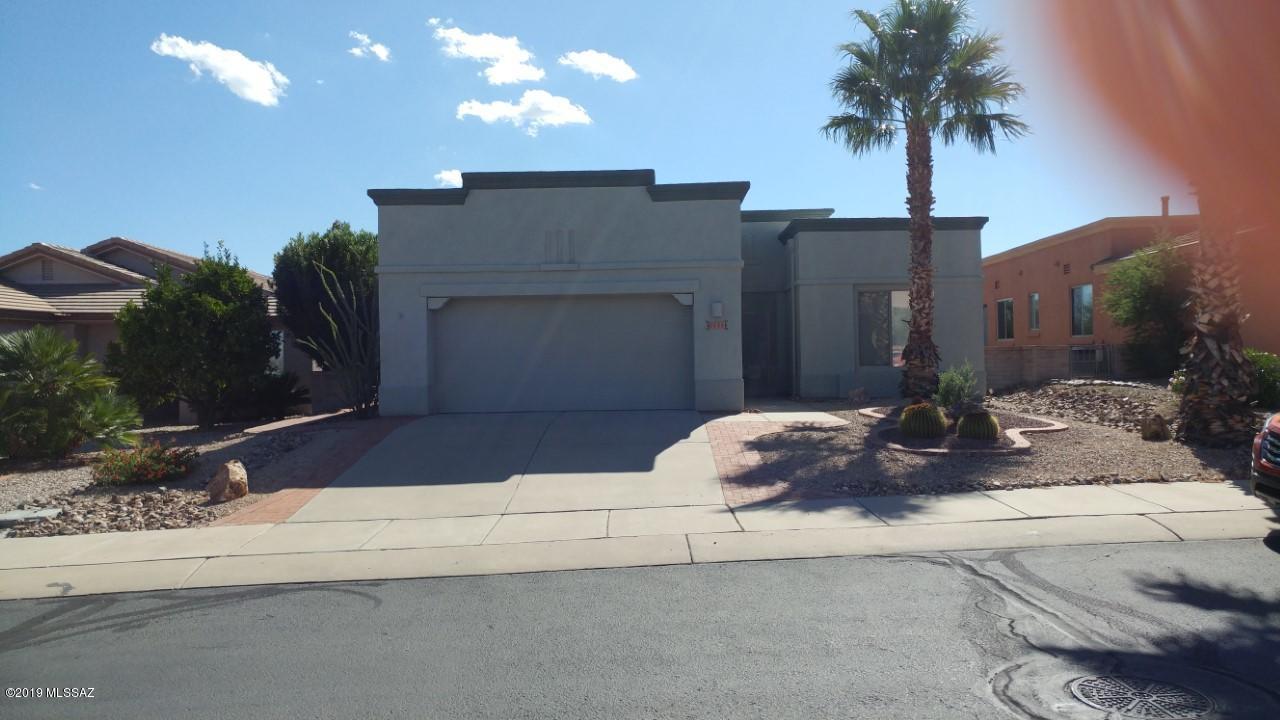 If you are looking for a home you can move right in to this is it! As you walk in the front door your eyes are immediately drawn to the wall of windows overlooking the beautifully landscaped back yard. This is a great open floor plan for enjoying our natural light and for entertaining. The upgraded kitchen is separated from the dining room by a breakfast bar and the sliding doors take you out to a spacious covered patio for all your entertaining. Roll down solar screens will keep you cool while enjoying our beautiful sunsets. Two spacious bedrooms and two full baths are featured and just wait until you see the fabulous walk in closet in the master bath. The master bedroom has a large bay window that would make a great reading spot. Right off the kitchen is a great office nook and then in the extended garage you have a wall of storage cabinets for all your goodies and a utility sink. If we experience a cool spell there is an electric fireplace in the living room for your enjoyment. With it's warm neutral colors to accent any decor this one is truly move in ready. Give me a call when you want to take a look.