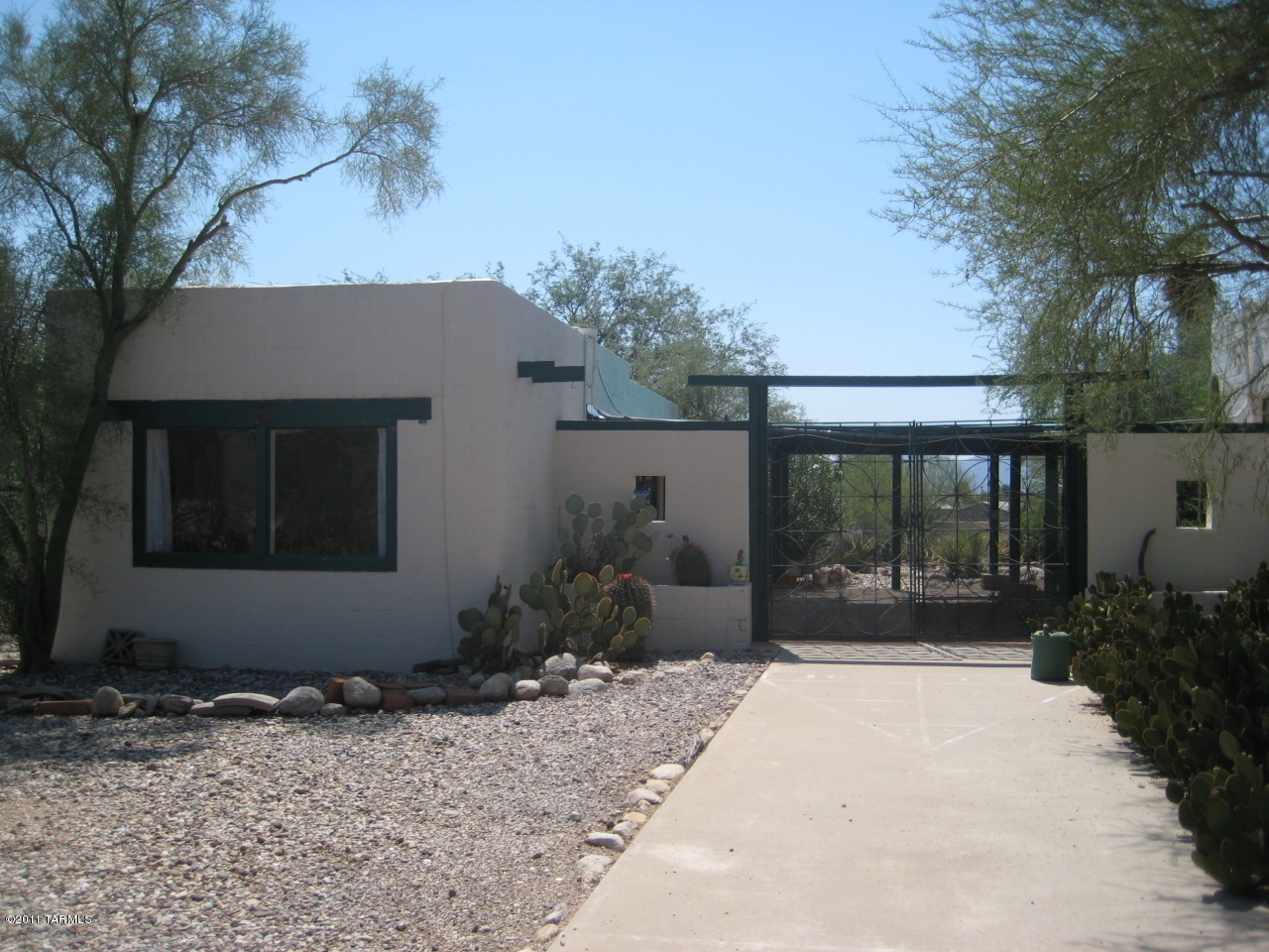GUESTHOUSE - fully furnished with private entry in a beautiful and natural environment, special and charming on 2.5 acres, separate and cheerful large kitchen/dining area, spacious great room/bedroom studio plan with picture window.  Your GUESTHOUSE is complete with all furnishings including dishes and has a tasteful style from suede dining chairs and accent lighting to a matching highrise headboard and a couple unique pieces.  Sparkling pool shared with main house.  Mountain views, a colorful sunset, and amazing nature, yet close to everything.  -Fabulous lease with all utilities including wifi, basic cable, and shared w/d room.  This guest house is an enjoyable place!