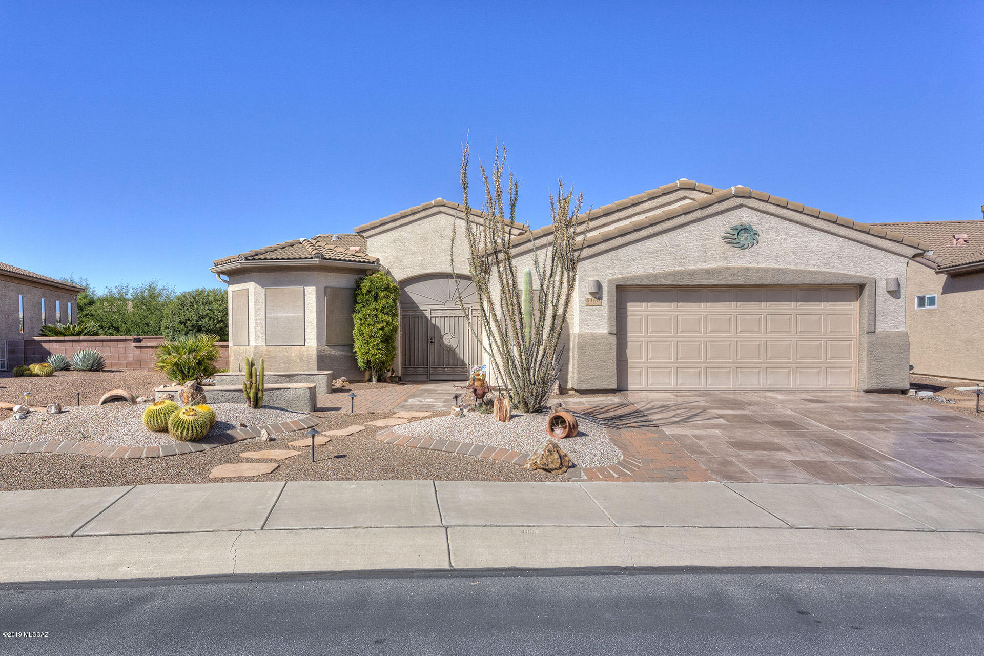 Super Lovely Home with an Excellent Floor Plan! 2 Bedrooms, 2 bathrooms, open den and an office/hobby/laundry room and a 2.5 car garage that is extended.  This home has everything you want and more! Great View of the Santa Ritas from the front sitting area and a desert  view from the back, tile flooring, updated appliances, newer HVAC, beautiful countertops, 3 bay windows, a door from the master bedroom to the screened patio, easy care landscaping front and back.  This is a must see!!