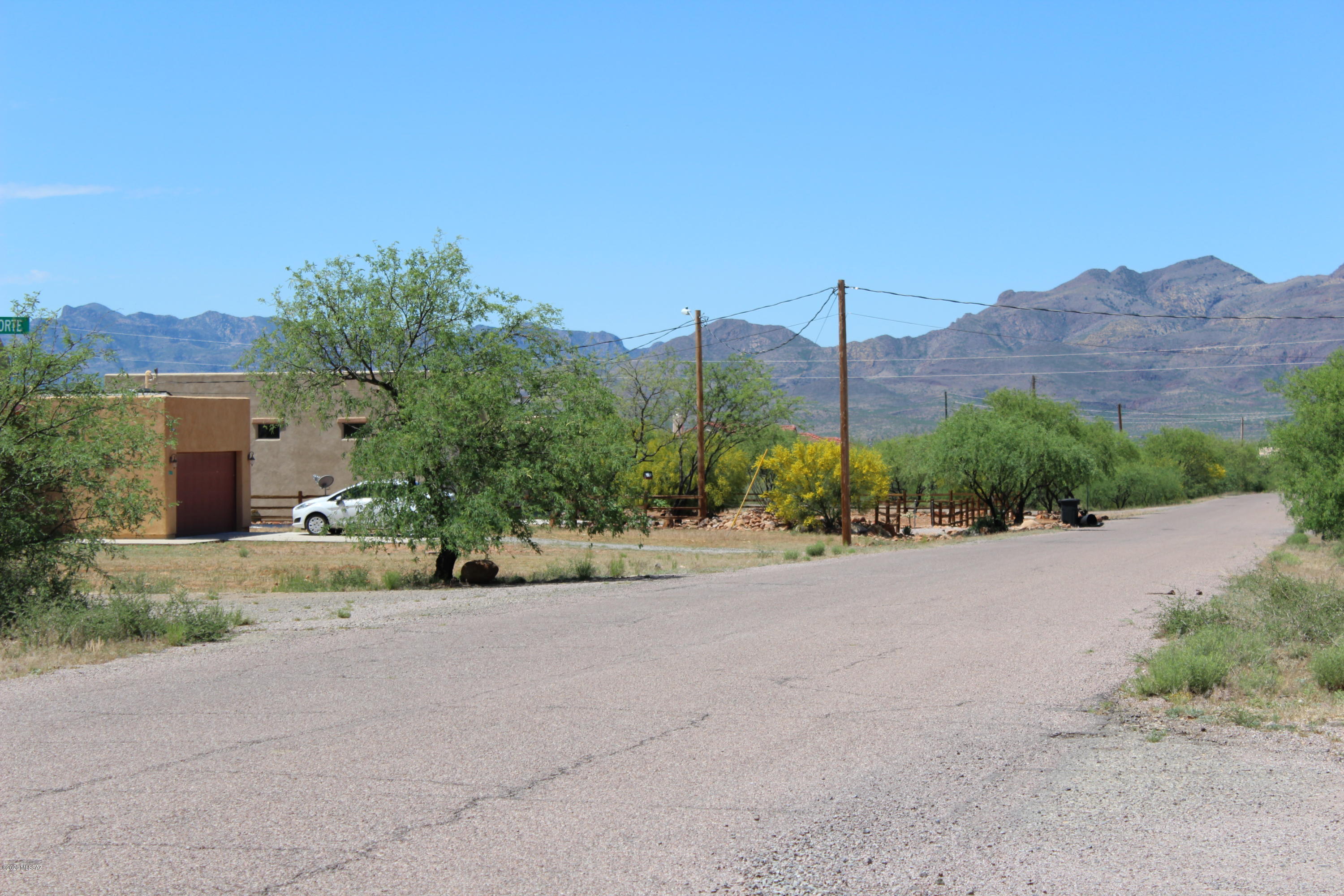 Corner Lot! Beautiful Views located on cul-de-sac. Nice flat land to build your dream home. Water, Electricity and Sewer to lot. This property is tucked away in the stunning East side of Rio Rico surrounded with mountain ranges. Enjoy country life while close enough to I-19 to visit friends or nice commute to south or north. Located just minutes away from unique artist town of Tubac for shopping and entertainment. Just south of Green Valley for golf, shopping and restaurants. Property is located in area with custom and semi custom homes. This is a great piece of property, worth taking a look and being surprised by its beauty.