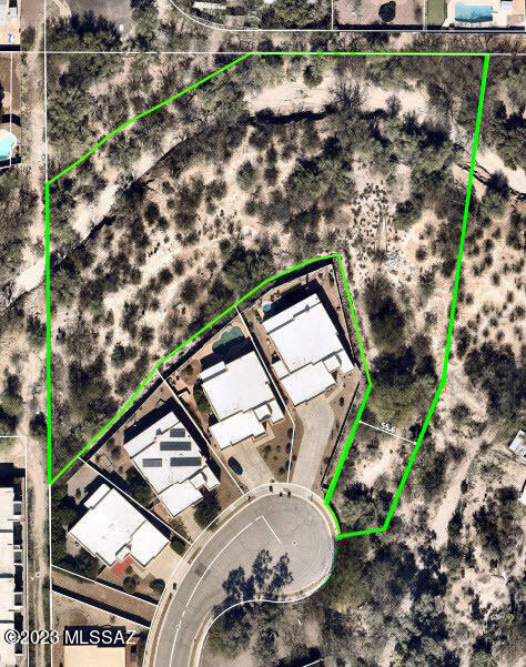 Discover this rare, secluded treasure in the heart of northeast Tucson an expansive 1.995-acre parcel with accessible electric, water, and sewer connections. This serene and tranquil enclave provides an atmosphere of peace and privacy.  Enjoy mature native trees and cacti, occasional javelina or coyote, and numerous birds including a family of beautiful hawks. The property is accessed through a private gate, shared exclusively with one other property owner. Adding to its charm, this parcel offers stunning views of the Catalina Mountains to the north and the Rincon Mountains to the east. Its strategic location, just off Speedway Blvd and Pantano Rd, offers easy access to all parts of Tucson. In addition to the natural attractions close by - like Mt. Lemmon, Sabino Canyon, and the Saguaro N Saguaro National Monument - you'll also find schools, shopping centers, and recreational facilities nearby. The University of Arizona and Pima Community College East are just a 15-20 minute drive.  Don't miss out on this hidden hard-to-find jewel in
Tucson, Arizona.