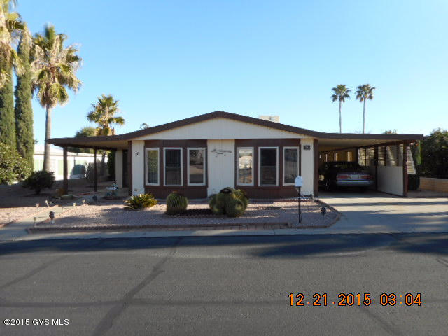 Quality built, well cared for 3 bedroom ONE OWNER HOME. As you enter you will see a spacious living room and dining area along with vaulted ceilings throughout. Great Kitchen with water purifier, lots of cabinets along with a big pantry. Den has glass sliding doors opening onto a glassed in Arizona Room with it's own storage room. Very large master bedroom with mirrored closet doors. Master bath has it's own closet for linens, towels, etc. The other 2 bedrooms are of good size. Laundry room has it's closet and cabinets for storage. In the carport area there is a large workshop. Well landscaped that is easy care. Windows in home have been replaced, along with carpeting and some appliances. Under termite warranty with Terminix. Water softener, evap coolers and irrigation system sold AS  IS. Great location, close to recreational facilities.