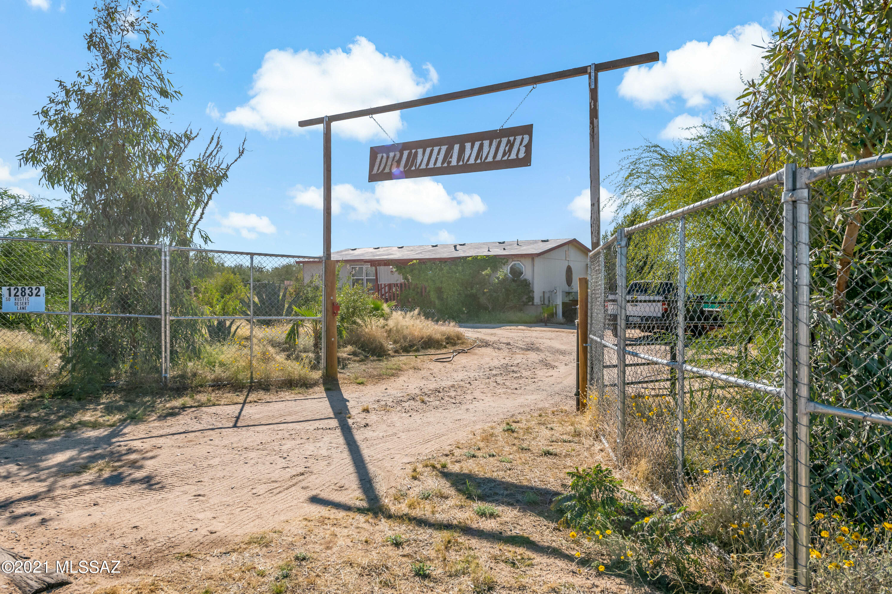 Well maintained 3 bedroom home sitting on over 1 acre backs up to miles of state land.  Current owner has planted a variety of agaves, palms, eucalyptus and palo verde trees, and  
large saguros throughout the property. 

Living, dining and bedrooms are light and airy with laminate flooring.  Master bedroom features on suite with soaking tub and separate shower and a large walk-in closet.
Kitchen features tile floors, island, pantry, newer appliances and gas range.

Bask in Arizona's colorful sunsets and then watch the twinkling stars from your private deck or relax on the shaded patio. Enjoy the seasonal creek bed at the rear of the property.  Property is crossed fenced for grazing livestock or horses.

Home comes with furnishings and all appliance