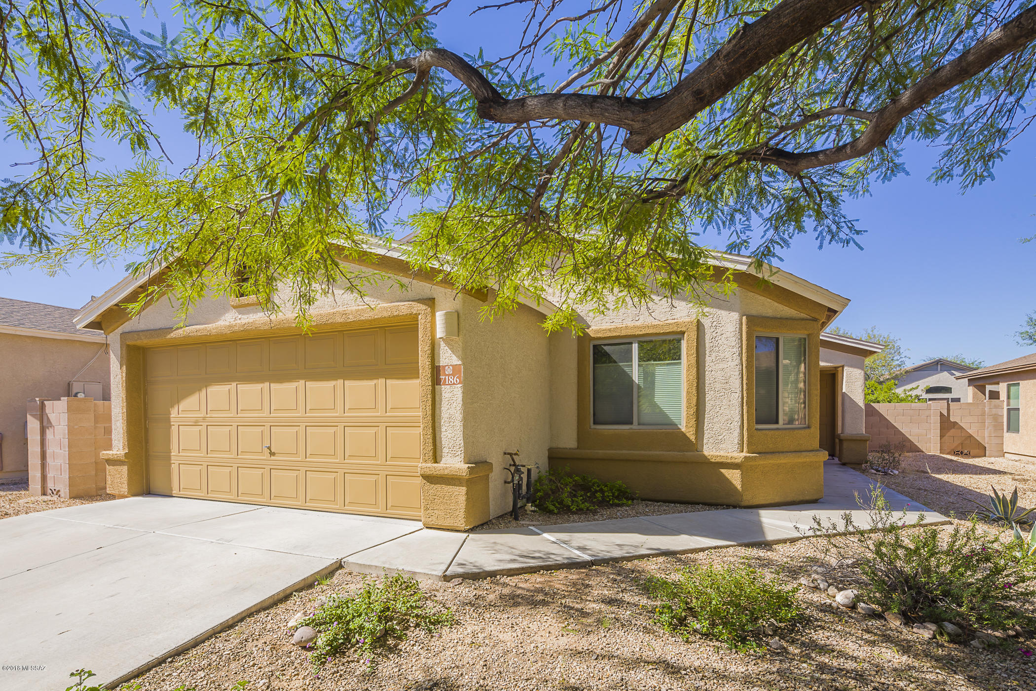 Beautiful 4BD/2BA, Contemporary home in desirable Canterbury Ranch, built in 2005.   Clean and move in ready! No carpet, beautiful ceramic tile floors thru out. Open spacious floor plan. Master bedroom has separate garden tub, shower and walk in closet. Lovely backyard. Solar Panel with low monthly payment is a HUGE savings feature. Easy access to Davis Monthan AFB and I-10. You don't want to miss this one, hurry on over!
