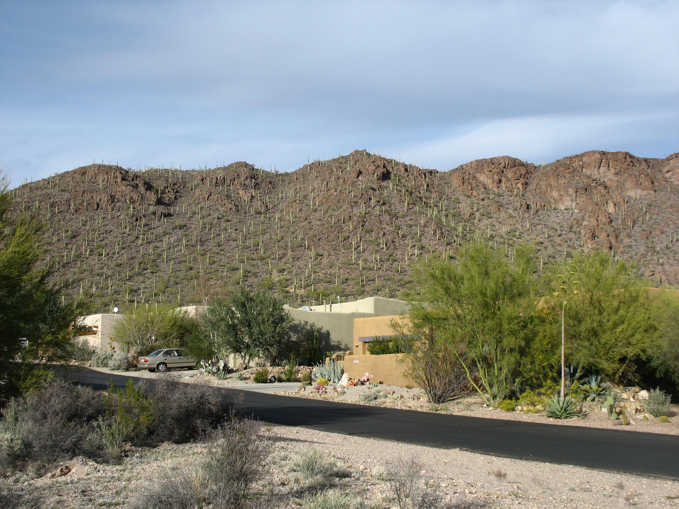 Lot located towards east end of the Tucson Estates No. 2 community on quiet street.  The lot is ready for you to build your custom home with great mountain views.  Choose your own floor plan.  The community has many amenities like pool, spa, tennis, pickle ball, bocce ball, and much more.  You are steps away from miles of hiking in the Tucson Mountain Park adjacent to the community.