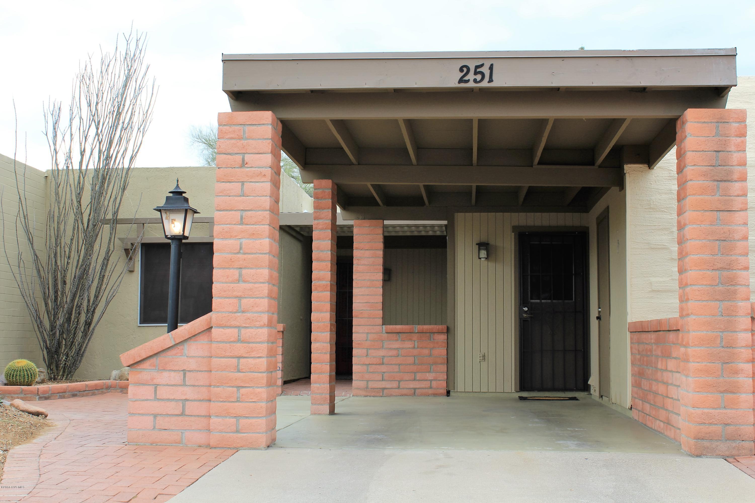 Look no further-this is it! You'll be please from beginning to end when you walk through this lovely townhome. The entrance welcomes you with a covered area and the quality finishes and extra touches throughout. The kitchen has a stainless fridge, dishwasher and micro, a new deep sink, rich, dark laminate flooring and a newer stack washer/dryer leaving room for a pantry area. The living room has an accent wall with grass cloth wallpaper, newly cleaned carpet and designer wall colors. The guest bedroom has upgraded closet doors to add quality to the room, and the vessel sink and designer faucet in the bathroom are a welcome touch. Step outside to the patio with privacy-enhancing, solid wood and lattice fencing on either side and common area in the back. Welcome home!
