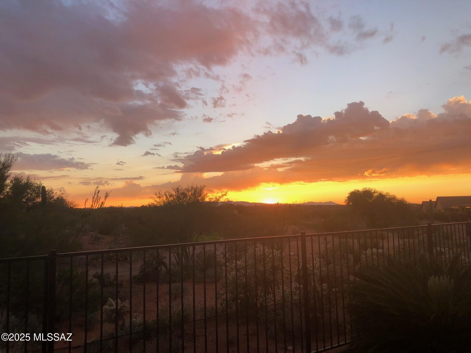 Must see like new 2BR+den/2BA w/extended 3 car tandem garage in 55+ community of Del Webb at Rancho del Lago located on 7th Green.You've got to see the private back patio on oversized pie shape lot w/mountain views.Listen to the soothing waterfall while gazing at migrating birds w/an afternoon drink or morning coffe/tea.Enjoy views of the Rincon mtns from front patio w/no homes directly across the street.Interior is immaculate w/lots of tile,gourmet kitchen,upgraded lighting,french doors from great room leading out to patio w/auto roll down screens.Primary BR w/bay window, view & 2 walk-in closets.Large laundry w/sink & cabs.Guest BR has wonderful views.Lots of extra storage closets & garage is huge for workshop, storage,golf cart,or extra vehicle.It doesn't get much better than this one!
