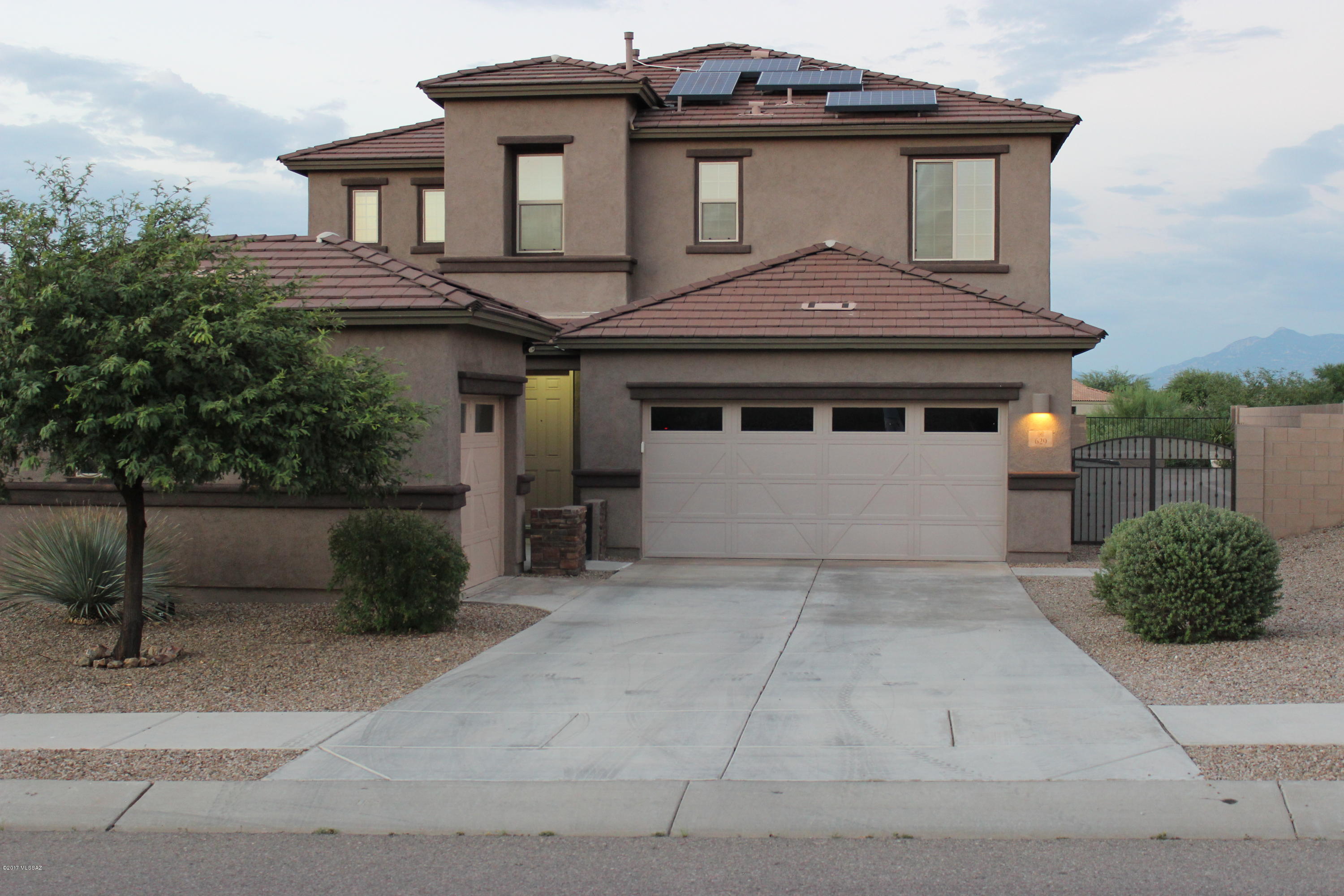 Seller will accept or counter offers between $265,000 and $270,000. grill and kegerator outside, wine fridge and shelves in garage do not convey. Stunningly Beautiful 4 bdrm 2 1/2 bath with den in award winning Vail school district. Too many upgrades to mention them all, Seating area with fire pit, Low maint. pet turf and flower bed in back yard, Custom extended island, Drop down lighting over island, Custom gourmet kitchen, Top of the line appliances, Upgraded ceiling fans throughout, Surround sound both inside and outside, Custom walk-in shower in master bathroom, and much much more. This is a must see Home!!!