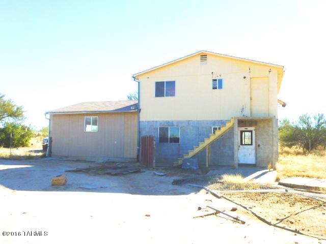 Owner/agent selling intriguing MAJOR fix-up with great potential. Downstairs is rough and unfinished, though upstairs was occupied in past. Total structure is much larger than assessor's 588 sq ft; permits exempt when built per county. Room descriptions creative. In-ground cisterns exist for water harvesting. No other water service currently available, so would need to use existing cisterns, drill well, and/or haul water. SH zoning allows additional unit. Obtained in foreclosure so details unknown. TRICO electric. Sold strictly as-is. Bring your imagination!