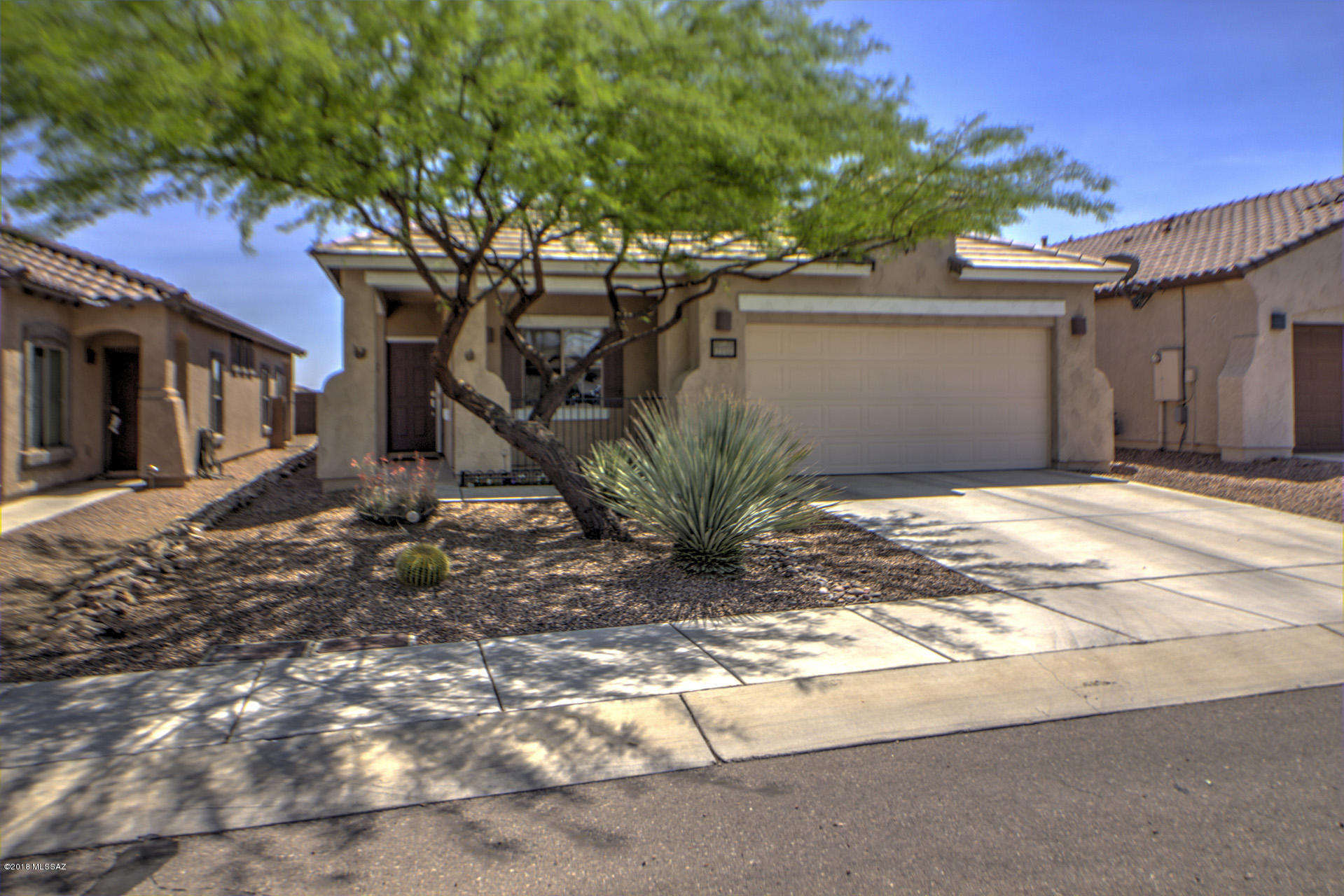 Move in ready & built by Pulte, 3BD/2BA, 1,800 Sq Ft home with a 2-car garage appointed in a cul-de-sac in the desirable community of Rancho Sahuarita welcomes you with a foyer that opens to a spacious kitchen, family room & a formal dining area. Kitchen features a breakfast eating area, island, granite counter tops, stainless steel appliances, water reserve osmosis & plenty of cherry oak cabinetry space with pull out drawers. Family room features pre-wiring surround sound system & easy access to a covered back patio with pavers, mature vegetation, stacked stone planters & privacy with no rear neighbors. Hallway leads to 2 bedrooms & a full bath with shower/tub. Spacious master suite with a walk in closet & dual vanities in master bath with cultured marble counter tops & a walk in shower. Spacious laundry room with built in shelves and a water softener. Enjoy all the amenities that Rancho Sahuarita has to offer from community pools/water park, a room with built in shelves and a water softener. Enjoy all the amenities that Rancho Sahuarita has to offer from community pools/water park, a