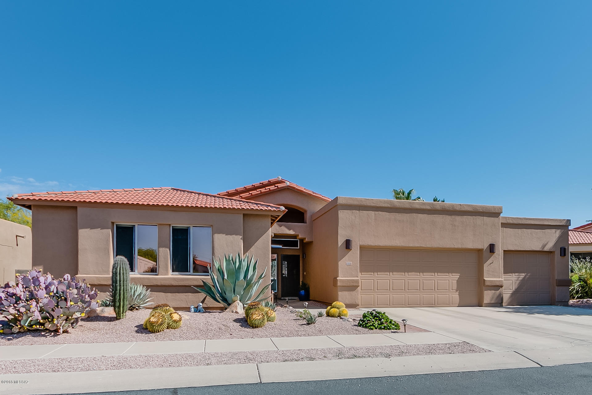 Exceptional 4BD,  (2,046sqft) 3 car garage home  nestled in a cul-de-sac in the heart of Oro Valley. Enter this home and you will find a spacious open floor-plan with a large great room. Open concept kitchen with SS appliances & plenty of storage. Enjoy the spacious master suite and luxurious master bath featuring garden tub, walk in shower and large walk in closet.  Outdoor living at it's absolute finest! Covered/Uncovered patio with built-in bbq and spacious grassy area for play. Sparkling salt water pool. Don't forget to enjoy the views from the pool deck. This home is in immaculate condition and a must see!
