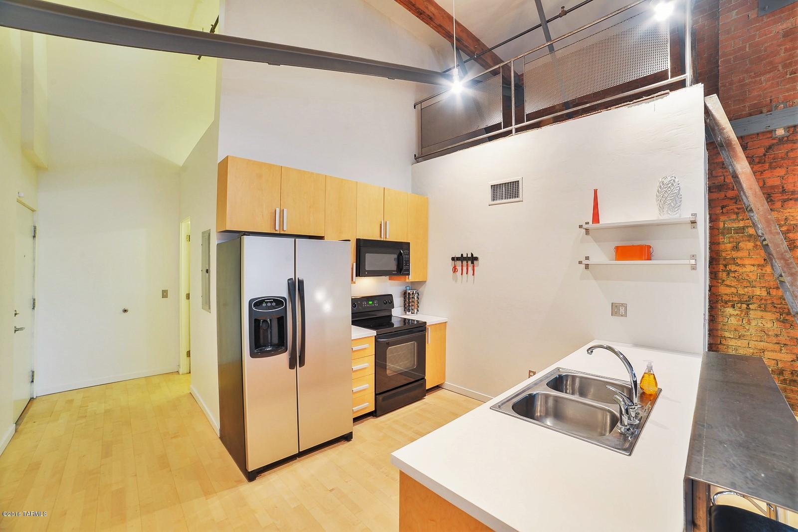 The Ice House Loft offers an Urban Industrial Lifestyle and a community of likeminded individuals who appreciate the history, architecture and originality this property embraces. 
This Loft is a studio space which includes a storage loft, large walk in closet with additional storage and a washer dryer.  The dramatic high ceilings and clerestory windows give a feeling of space and light.
The property also offers an onsite gym, pool, hot tub, gated entry and covered parking for residents.

The HOA covers water, pool, and all exterior maintenance so all you have to do is enjoy the beauty of your surroundings. 
The Ice house lofts are a perfect property if you travel for fun or pleasure as you can just lock up and take off. 
The security gates offer security, privacy and ease of mind. If you enjoy the outdoors, bike paths are abundant and conveniently accessible. 
No other property in Tucson offers quite the lifestyle offered at the Ice House Lofts.