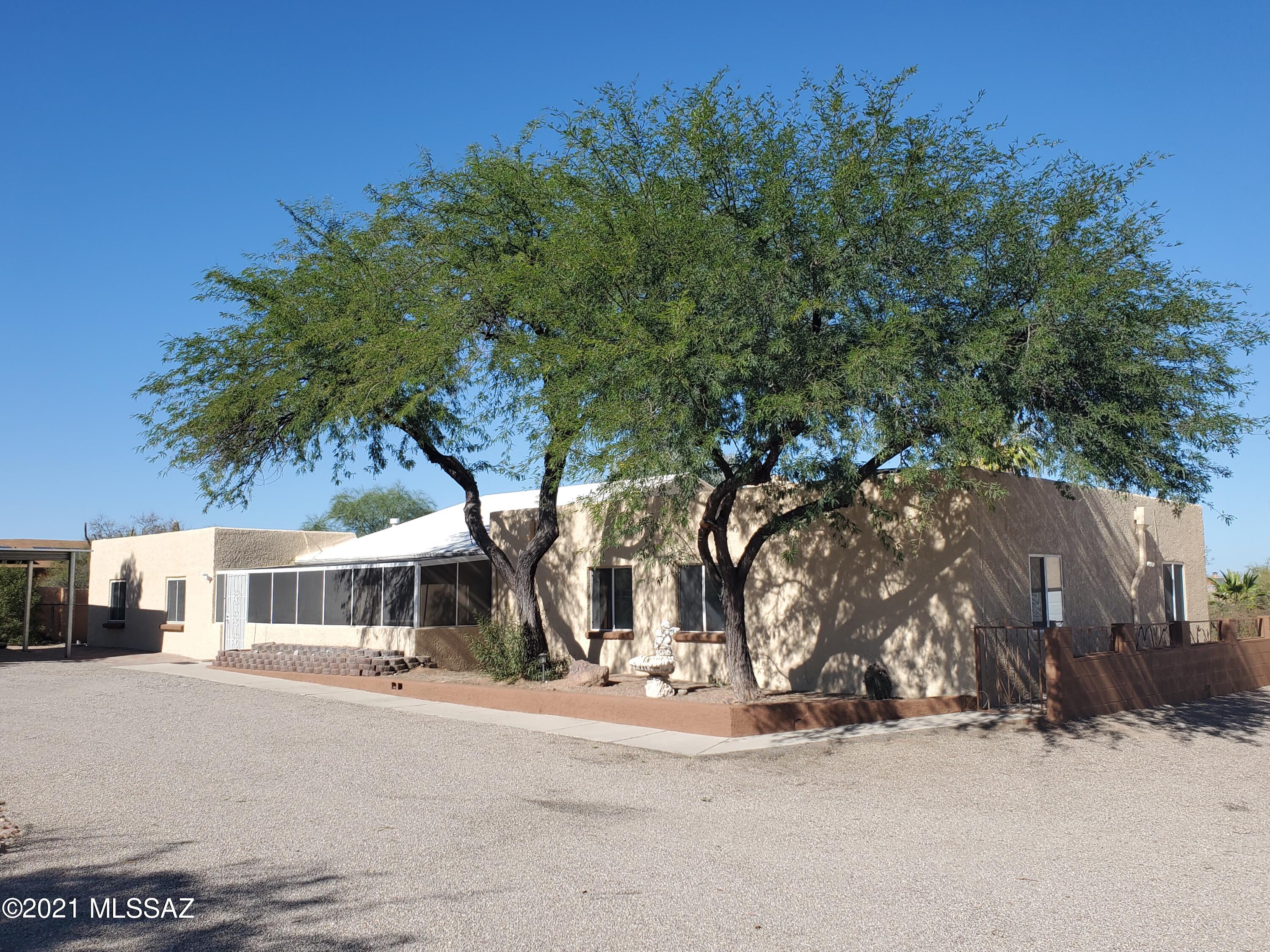Very well-maintained, 9 bedroom, 3 bath home on over an acre of desert oasis with plenty of saguaros, mature trees and native plantings.  Lot is completely fenced with custom block wall in front with 2 gates, 1 gate is motorized.

New paint inside & out, light and bright.  230SF fully screened Arizona Room.  Home is all 1 level.  There is an oversized 2 car garage and an additional 200 SF storage shed.    

Home is ready for immediate move-in with tons of possibilities!
