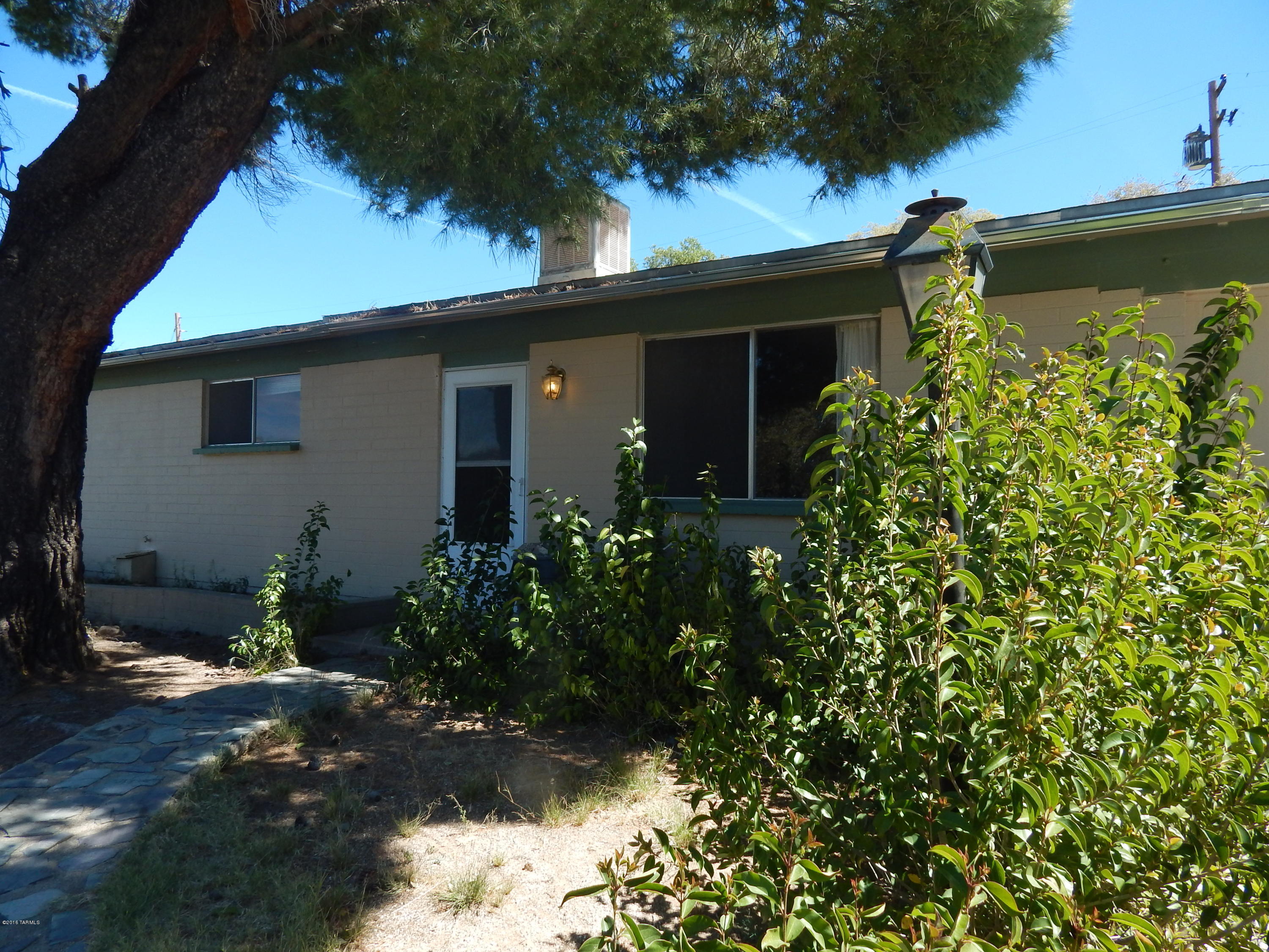 Spacious home with AZ room, bonus room and fenced yard with mature trees and two sheds. Washer/dryer hookups. Kitchen appliances included. Call today 520-419-6888