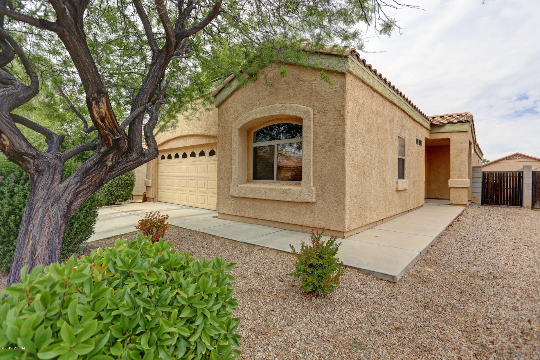 Welcome to Vista Montana Estates! An awesome gated community ! Here is a great opportunity to own a 3 bedroom 2 bath home in the Vail school district ! Rec area featuring : basketball court, weight room, pool and spa. Minutes to I-10, UA tech park, Amazon, Davis Monthan AFB, and Raytheon. Open great room and entertaining kitchen concept. Very nice Master suite and master bath with his and her sinks, garden tub, and walk in closet. Covered Patio, pavers,irrigation system, lighting a 3 hole putting green providing an amazing space to enjoy the evening or entertaining guest. Garage also includes pre plumbed / pre wired rough in for a future water softener. Also includes a brand new Lennox A/C unit purchased in 2019. Move in ready, show and sell.