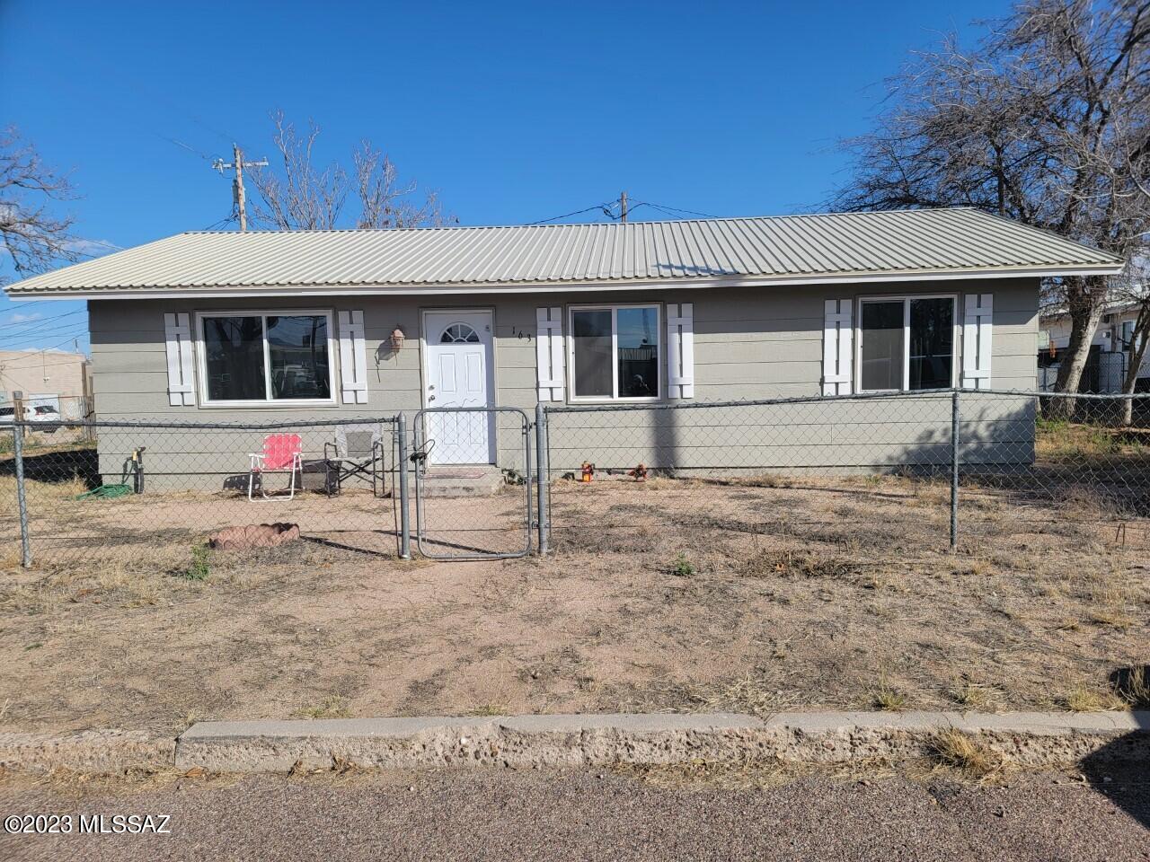 LOCATION, LOCATION, LOCATION! Recently updated with new flooring, new dual pane windows, new metal roof, new hickory cabinets, new HVAC, premium flooring and freshly painted too.  All kitchen appliances and washer and dryer too. Chain link fenced yard in town, close to schools, shopping, restaurants, library, etc. Partially furnished and furniture is negotiable.