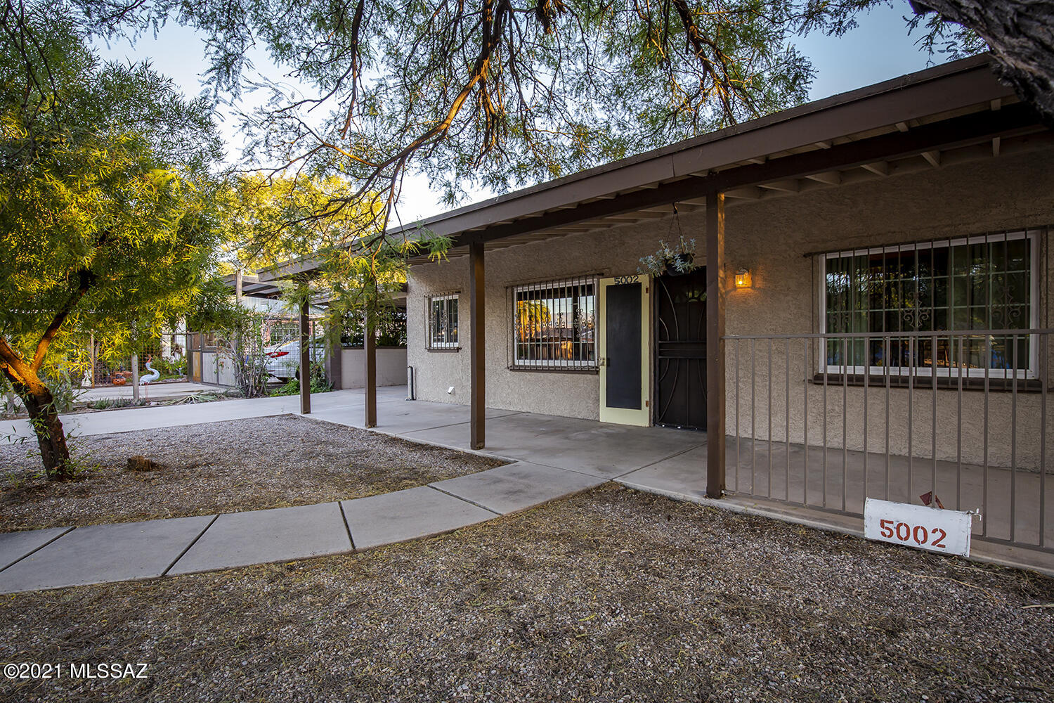 Great central home with separate guest quarters. Situated on corner lot with mature vegetation, the main house is 936sqft and has 2 bedrooms and 1 bath. It has nice living space and eat-in kitchen with granite countertops. The backyard for the main house is large with wonderful shade trees. The guest quarters is 416sqft and is tucked away from the main house, giving the new owner so many possibilities. Generate income, create a private work space, allow your college student or parent to have their independence while still living close. This property is convenient to almost everything central, don't miss out on this opportunity.
