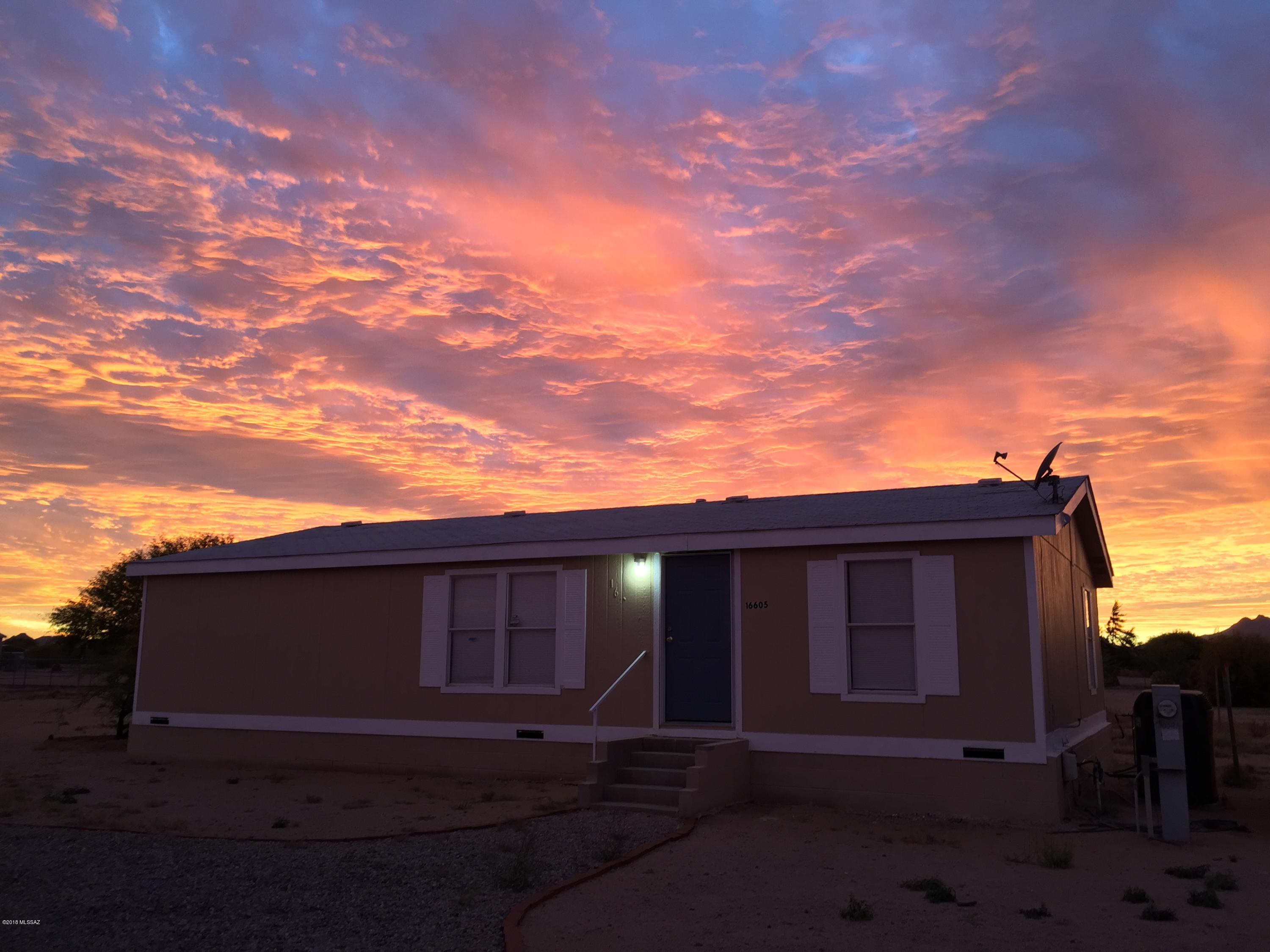 Range price listing. Seller will accept or counter offers between $99,999-$107,900. If you want room to spread out at an affordable price this home is for you! Three bedrooms and two bathrooms on just under an acre of flat, usable,  land on a corner lot. The floor plan is bright and open with a great room concept. The kitchen is updated with stainless steel appliances. No dirt roads leading to the property will keep your vehicles clean. Only blocks away from Roadrunner Elementary school. Come see this home today!