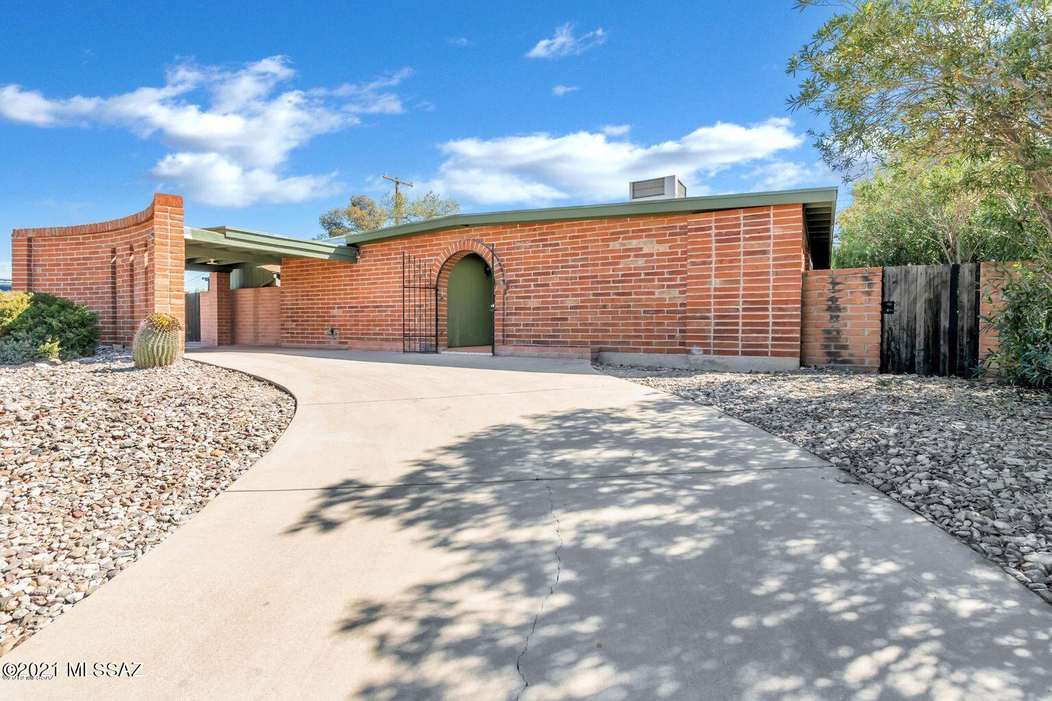Beautiful Eastside brick home on a corner lot with a covered circular driveway. This 4 bedroom, 2 bath home has multiple skylights which provide a ton of natural light. Cozy fireplace in the living room, and plenty of built-in storage in every room including in the large laundry room. Newer appliances in the kitchen and newer water heater. Roof re-coated in July 2019 with newer carpet in all bedrooms. No HOA and only 20 minutes to downtown and the U of A.  This is the perfect home to make loving memories for years to come!