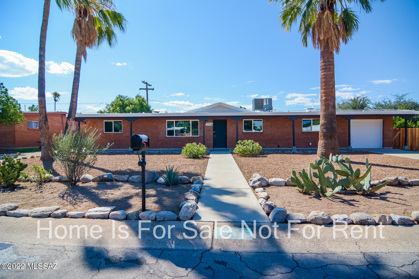 Vacant, sanitized and beautifully remodeled Ranch style home. Located in a convenient Central Tucson location. Charming brick construction. Rich wood look LVP flooring. Updated kitchen with stainless steel appliances. New custom interior and exterior paint. Fenced back yard with covered porch and sparkling pool. Brick pavers in back yard. Upgraded door hardware and light fixtures. One car garage. Mature vegetation. Dual pane windows. This home shows beautifully.
