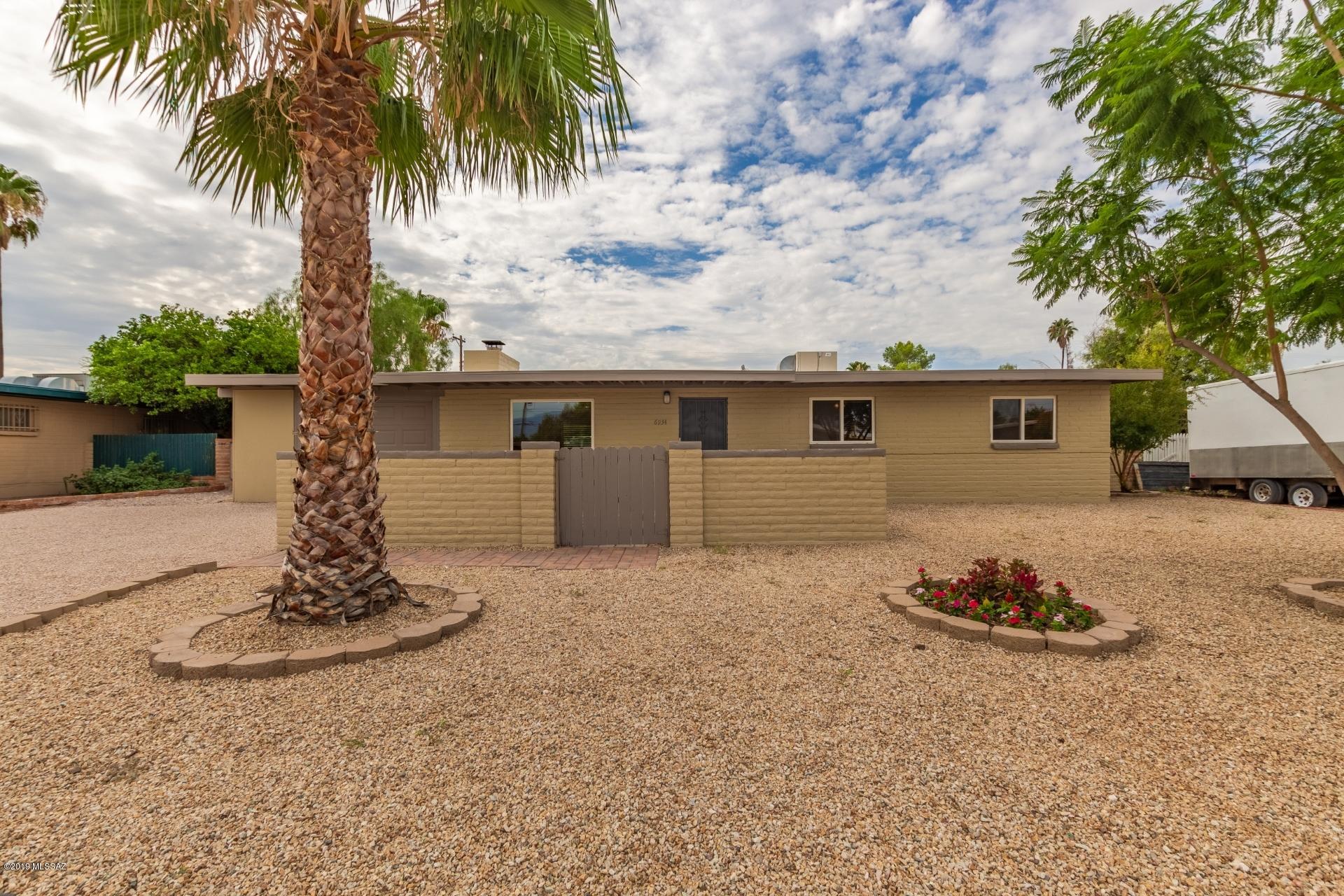 Charming 4 bedroom, 2 bath brick home located in desirable East side neighborhood. New kitchen with quartz countertop. New stainless appliances. Remodeled baths. Fresh paint inside and out. Awesome, large fireplace. Driveway redone with fresh chip seal. Beautiful tile throughout. Large Garage! Home is within walking distance of Palo Verde High School and surrounded by restaurants and shopping. Such a great location with plenty to do nearby! This home will not last long, come by and take a look today. Owner/agent