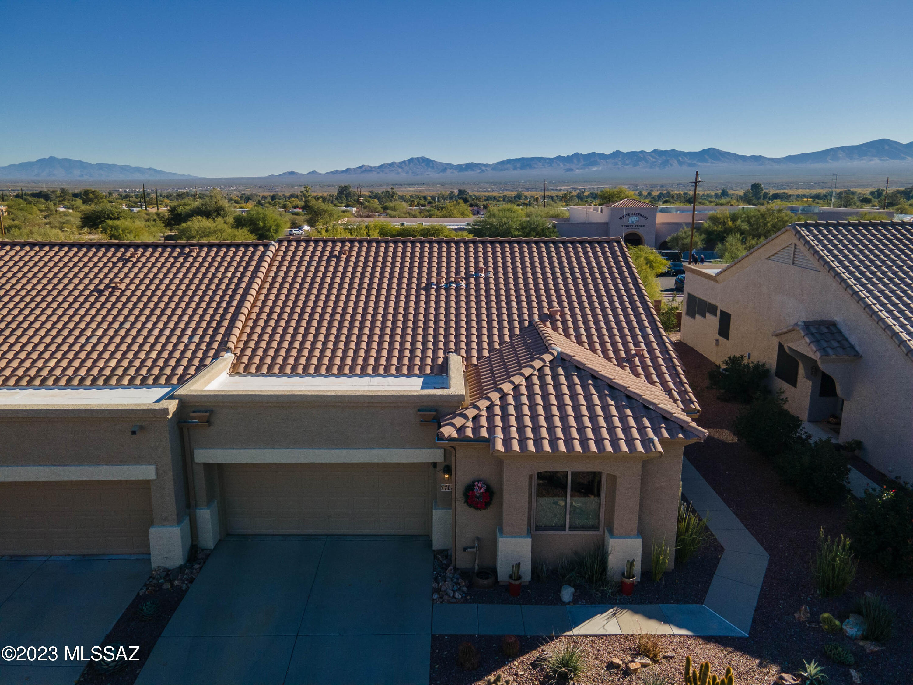 This fabulous townhome is totally updated with high end finishes, has a mountain view and a large Arizona Room.  Add to that you have a big outdoor space to entertain friends and family or just enjoy the great weather.   The kitchen has every detail thought out to provide the perfect Chef's kitchen.  The split bedroom plan is ideal for guests with the second bath having its own linen closet.  Both bedrooms have large walk-in closets.   The two-car garage is just a nicely finished.  With epoxy floors, and work shop area, and lots of shelving. All of this in a gated, friendly neighborhood with lovely park areas.