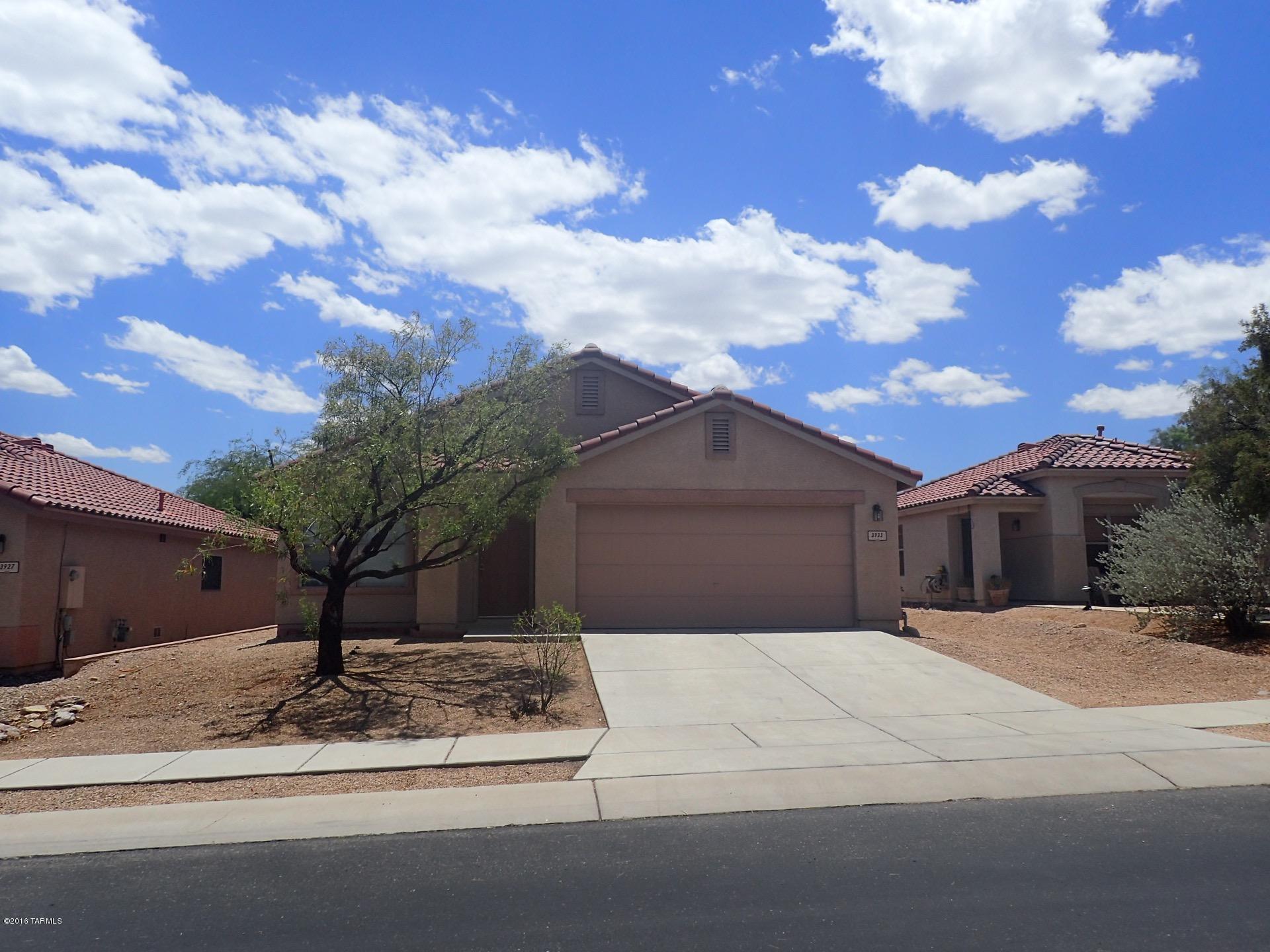 Freshly painted, reduced price: 3 bedroom, 2 bath plus den/office in gated community of Sweetwater Reserve.    

Eligible for Homebuyer Solution down payment assist (4% grant, no repayment)

Home features bright, open floor plan, spacious living/dining room, large family room off kitchen.  Very large Master Bedroom has walk-in closet.   Den/office could easily convert to 4th bedroom.  Decorative ceramic tile throughout, laundry room has shelving, two linen closets.  Hall bath is Jack & Jill-- accesses den & bedrooms.  Cozy east-facing backyard has covered patio. Great location near downtown, U of A, easy I-10 access.  Convenient to shopping & restaurants.  Minutes from Tucson Mountains.    Amenities: community pool, spa