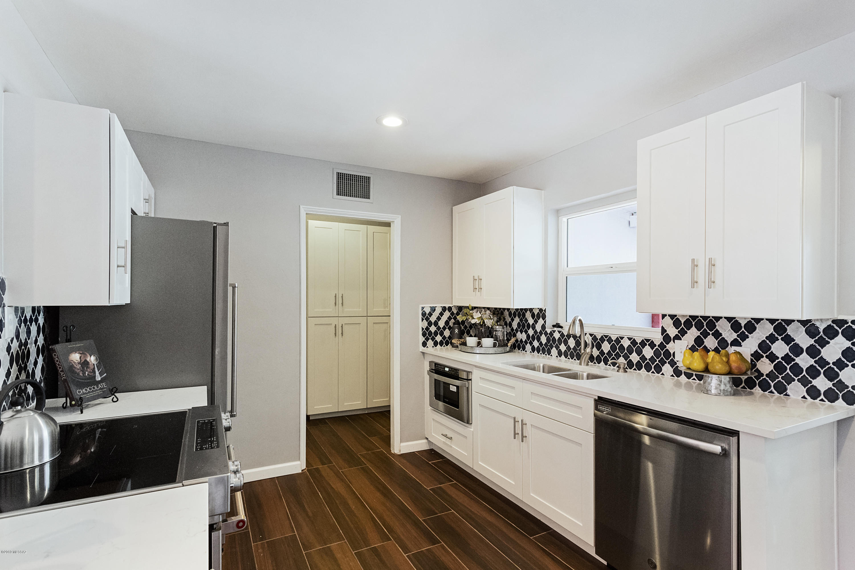 Beautiful renovation in highly sought after Blenman-Elm neighborhood. New master bathroom with dual sinks and quartz countertops. All new ceramic wood look tile throughout the home. Brand new kitchen with new cabinets and high end quartz countertops. Brand new stainless steel appliances. The large pool-size backyard has been completely rejuvenated. Only 5-10 minutes from the U of A and Downtown. Also walking distance to Culinary Dropout and new Grant Modern development currently under construction. Come experience what life in the city feels like!!
Listing agent related to sellers.